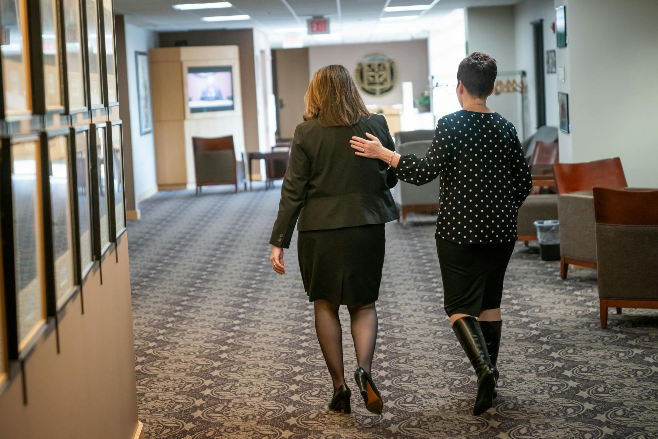 Joan Gabel, left, received a pat on the back from Sarah Dirksen, deputy director of the office of the Board of Regents after Gabel was unanimously voted to be the university's first female president.