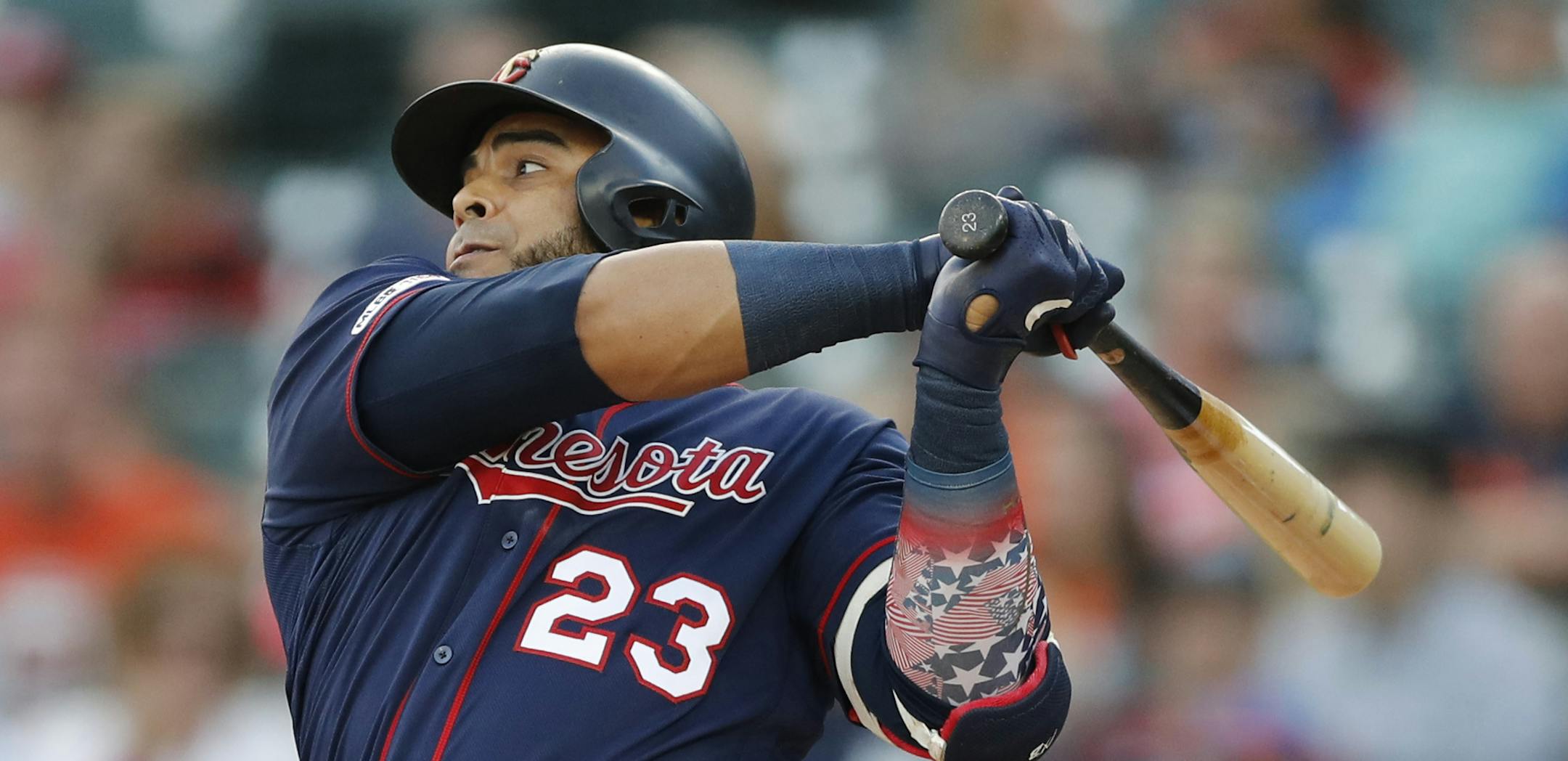 Minnesota Twins designated hitter Nelson Cruz follows through on an RBI single during the first inning of the team's baseball game against the Detroit Tigers, Friday, Aug. 30, 2019, in Detroit. (AP Photo/Carlos Osorio)