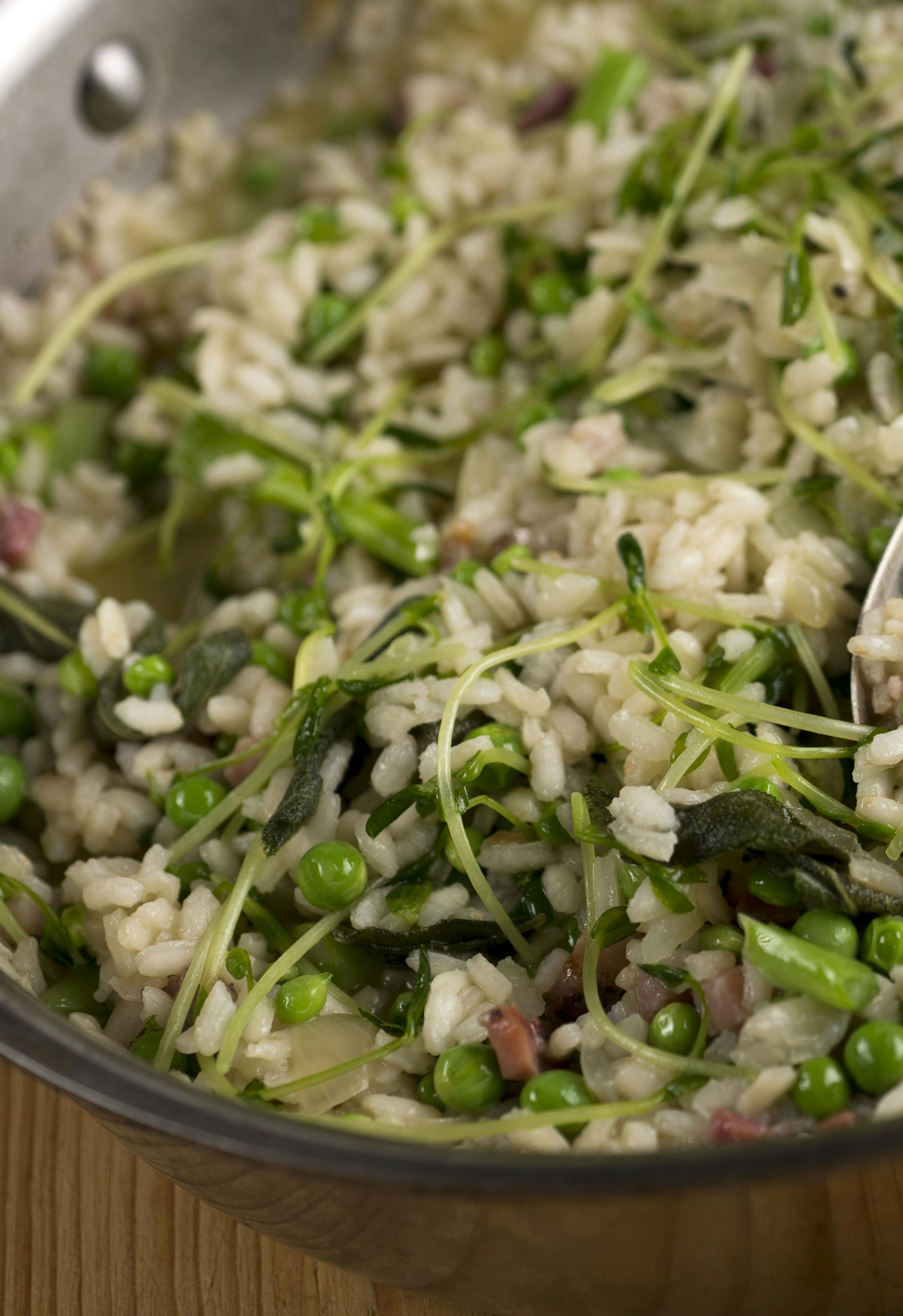 A pea and pancetta risotto dish, made with English peas and pea shoots, in New York, April 15, 2014. Most peas are eaten straight from cold storage, but when given the chance to taste sweet fresh green peas, there's a noticeable difference. (Karsten Moran/The New York Times)