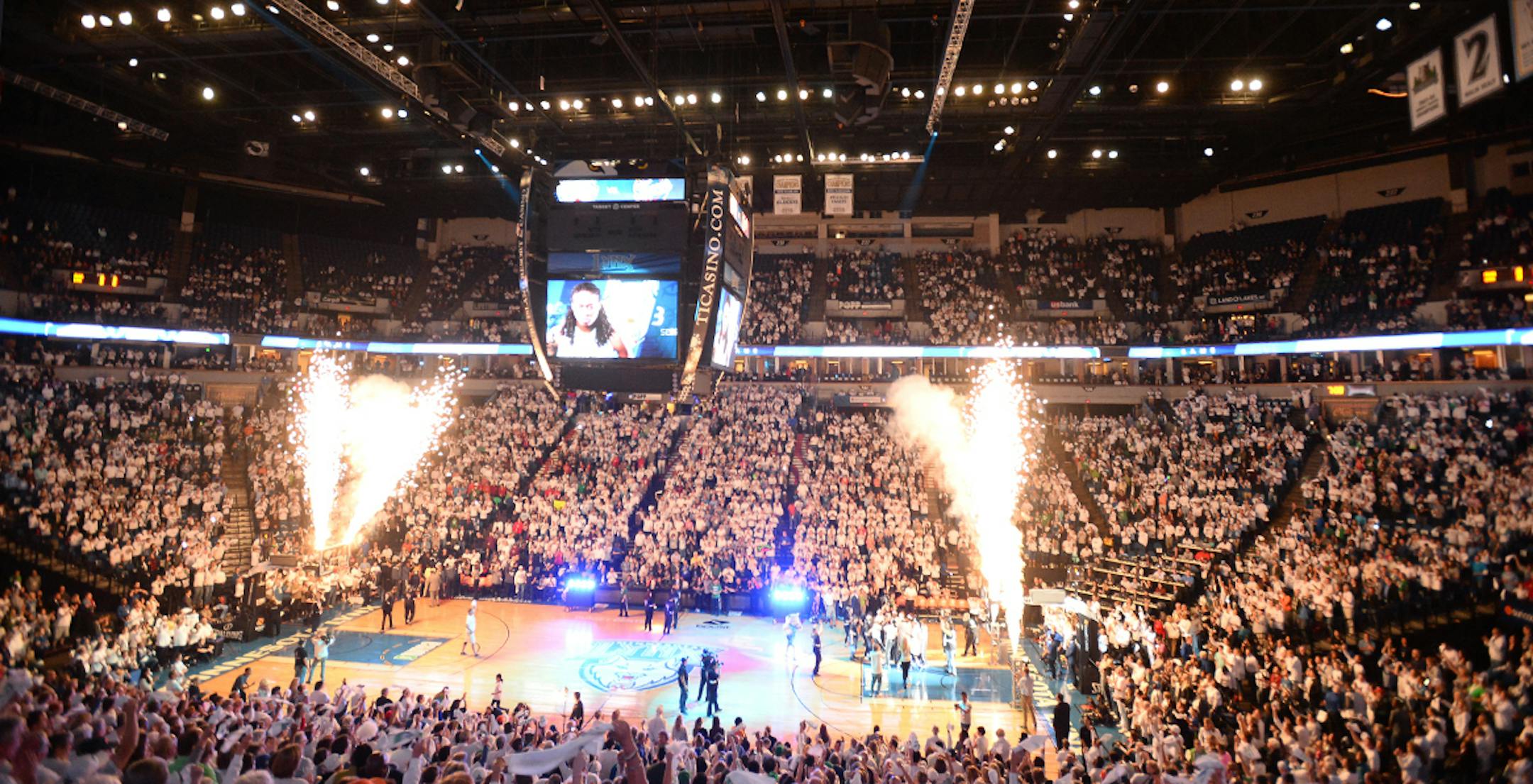 Pyrotechnics open the game at Target Center.