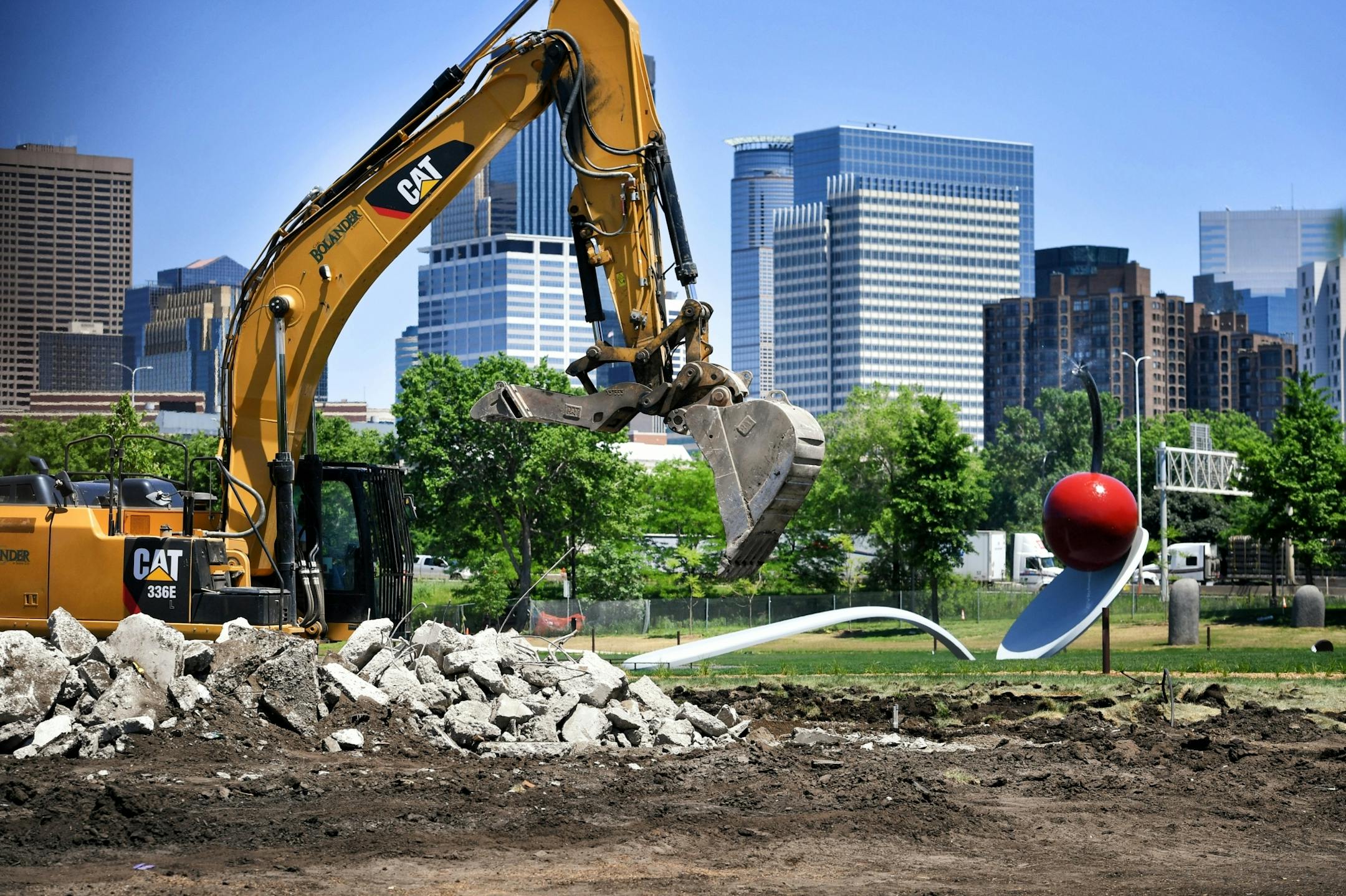 A pile of broken concrete was all that remained of "The Scaffold" sculpture at the Walker Sculpture Garden Tuesday afternoon. "Spoonbridge and Cherry" is in the background.