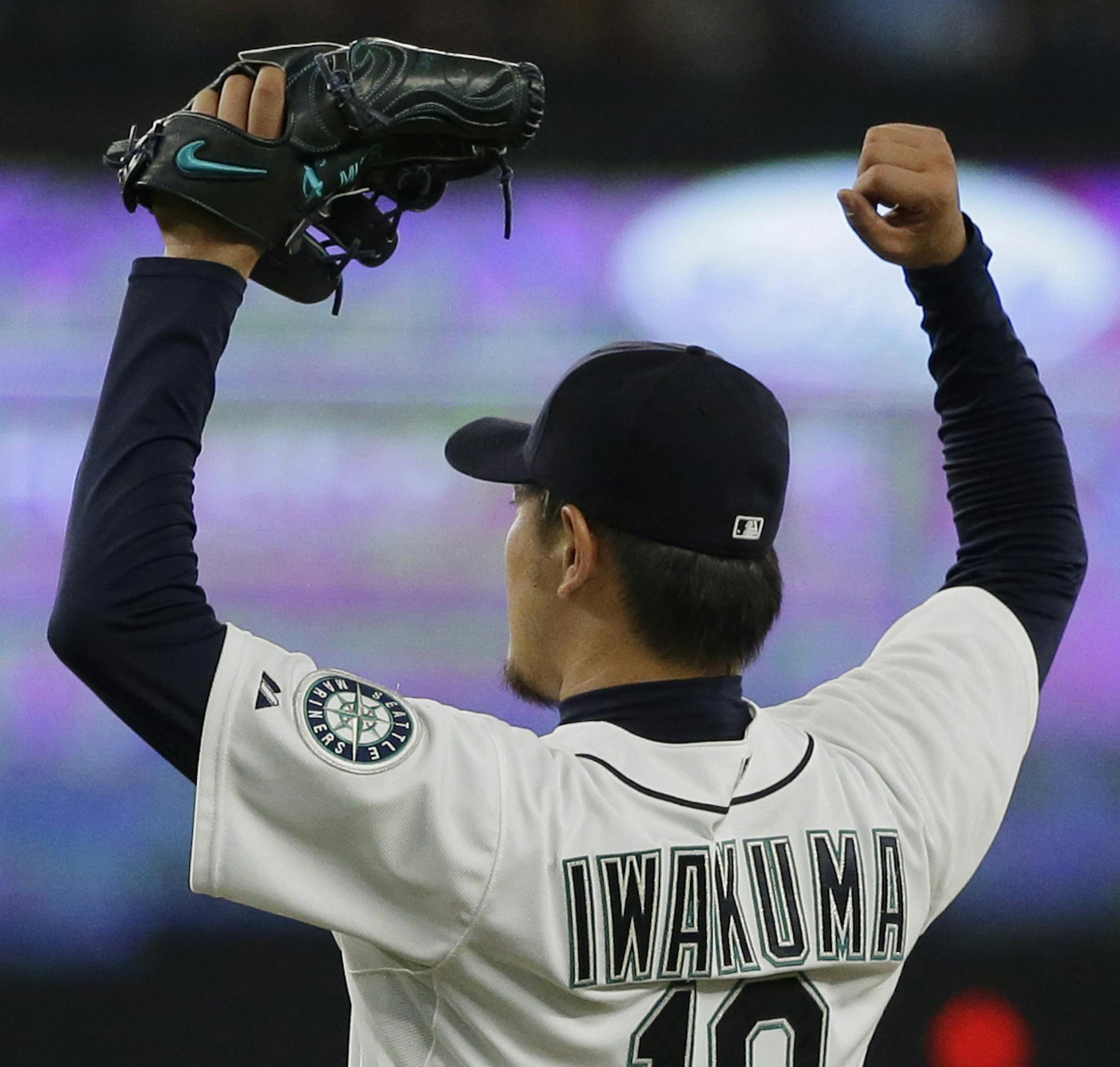 Seattle Mariners starting pitcher Hisashi Iwakuma reacts after the final out of his no-hitter against the Baltimore Orioles in a baseball game Wednesday, Aug. 12, 2015, in Seattle. The Mariners won 3-0. (AP Photo/Ted S. Warren) ORG XMIT: MIN2015083119030251
