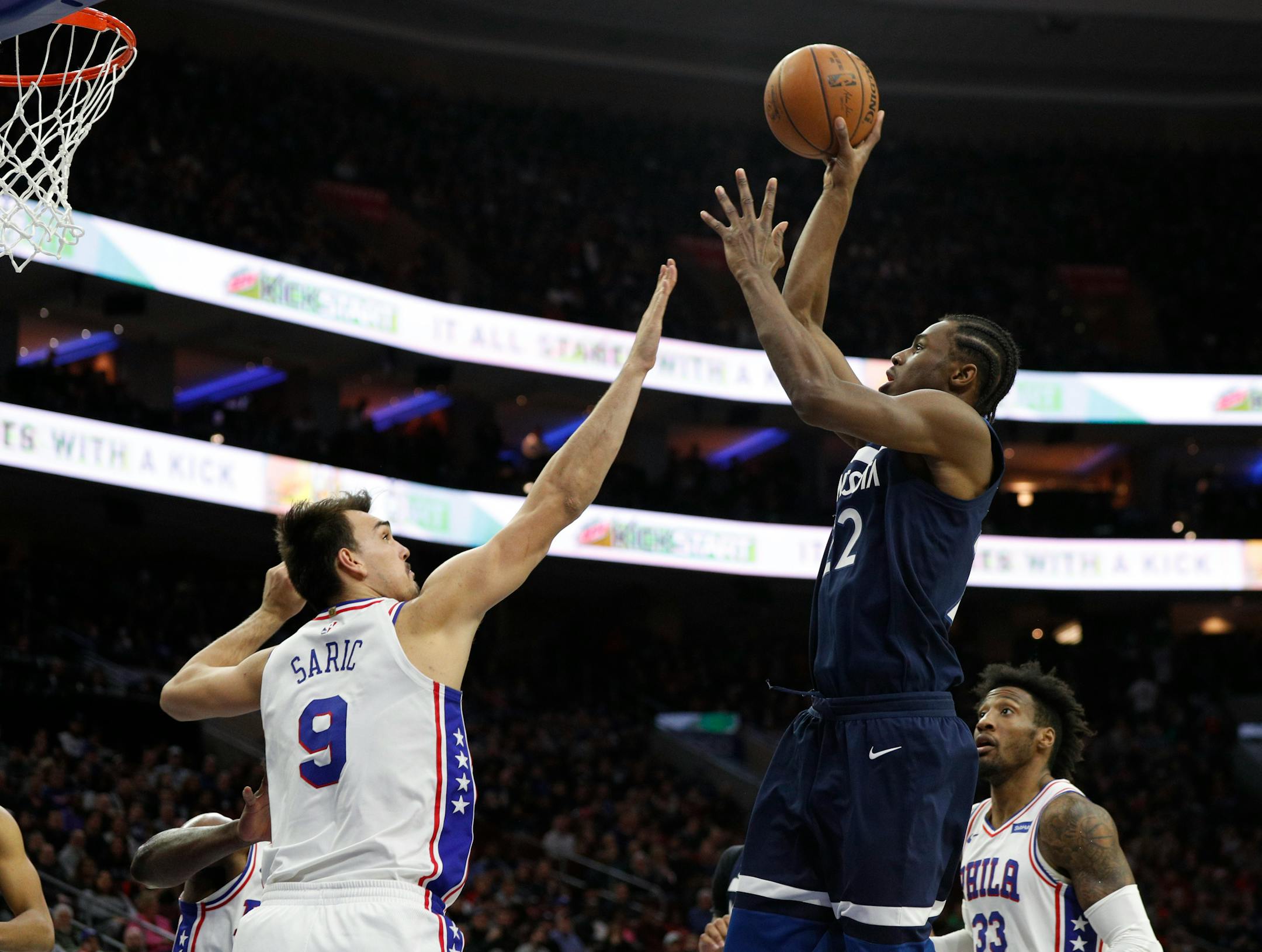 Minnesota Timberwolves' Andrew Wiggins, front right, shoots against Philadelphia 76ers' Dario Saric, left, of Croatia, during the first half of an NBA basketball game, Saturday, March 24, 2018, in Philadelphia. (AP Photo/Chris Szagola)