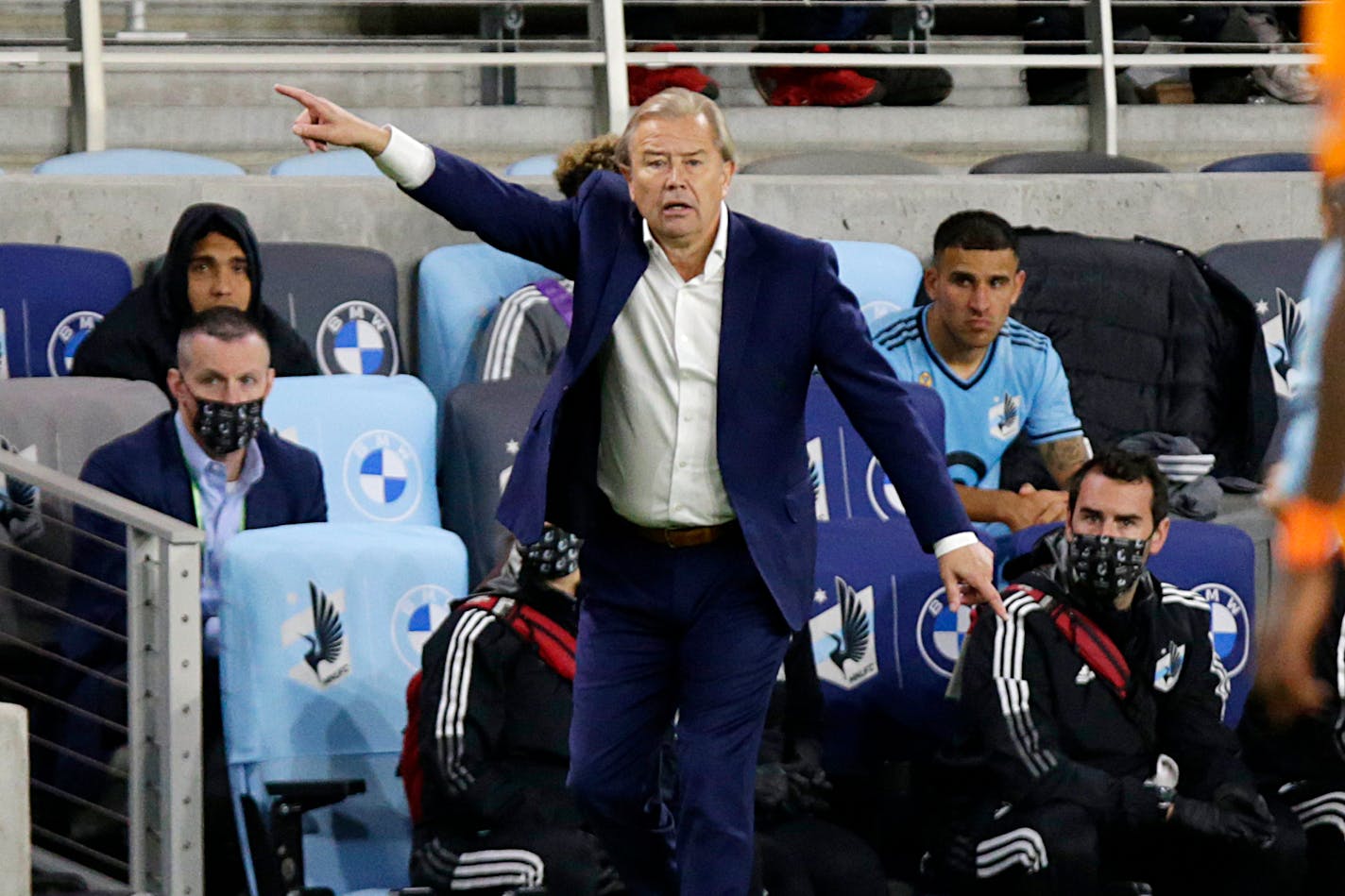 Minnesota United coach Adrian Heath directs his team against the Houston Dynamo during the second half of an MLS soccer match, Saturday, Sept. 25, 2021, in St. Paul, Minn. (AP Photo/Andy Clayton-King)