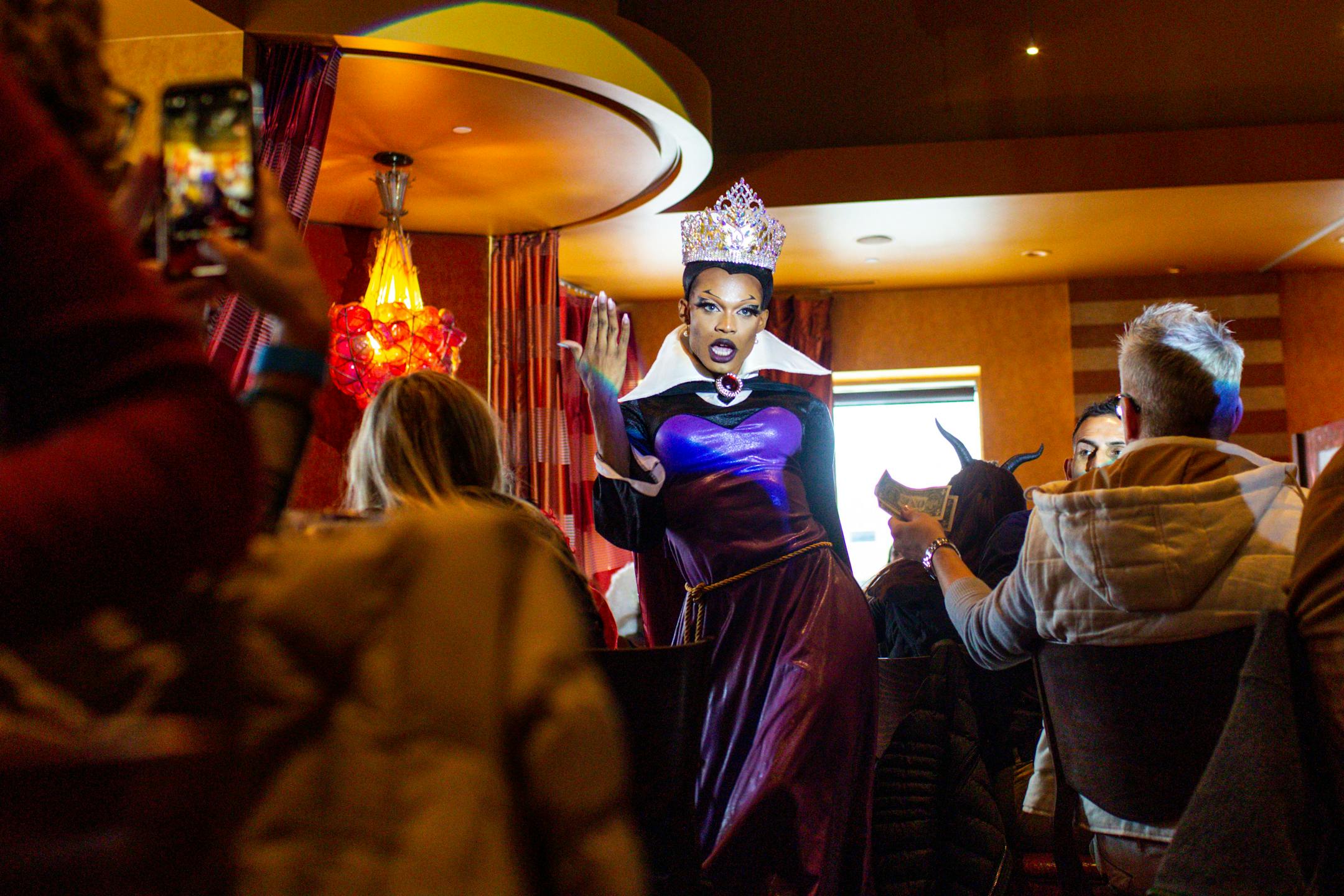 "Lady C. Cassadine" performs as the evil Queen Grimhilde from Snow White and The Seven Dwarves during a Disney Villains themed drag brunch through Flip Phone Events at CRAVE in downtown Minneapolis Sunday, Oct. 16, 2022