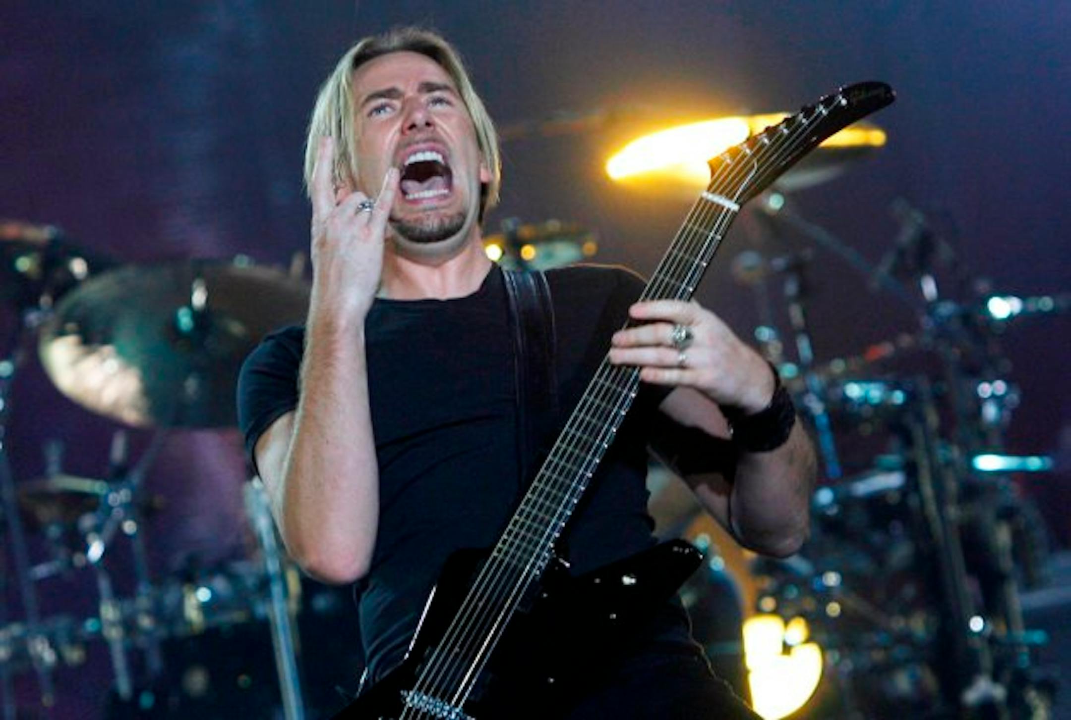 Chad Kroeger flashed the devil horns during Nickelback's 2010 show at Target Center. / Renee Jones Schneider, Star Tribune
