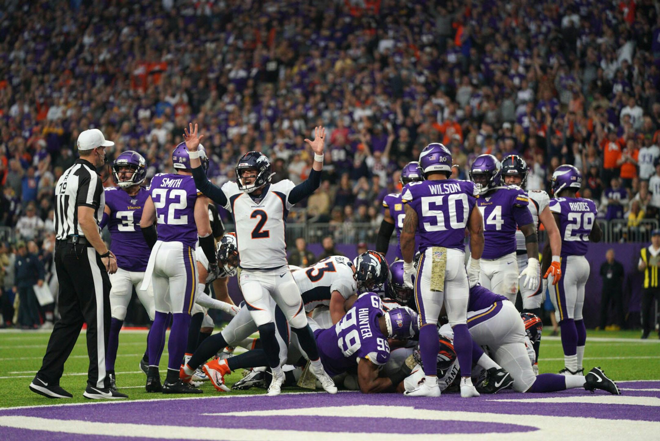 Denver Broncos quarterback Brandon Allen (2) reacted after teammate Andy Janovich scored a touchdown agains the Minnesota Vikings in the second quarter.
