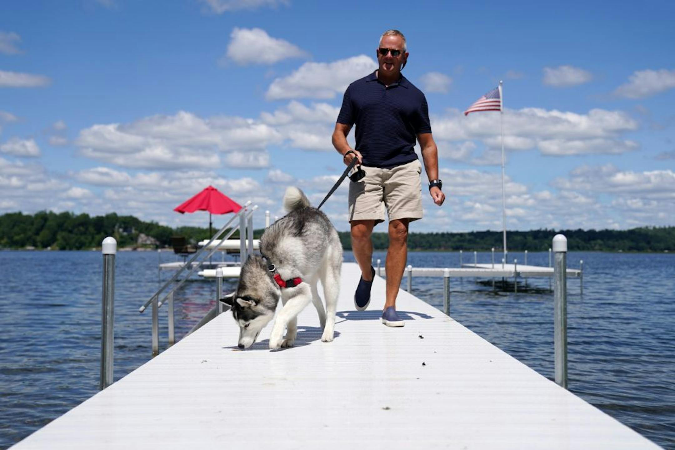 Todd Russell, a commercial real estate consultant from St. Paul, walked back in Thursday afternoon from his dock, where he often takes conference calls with his 1-year-old Siberian Husky Isabelle.