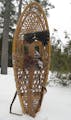 Snowshoes and an ax are essential gear for a winter camping trip to the BWCA. Doug Smith/Star Tribune.