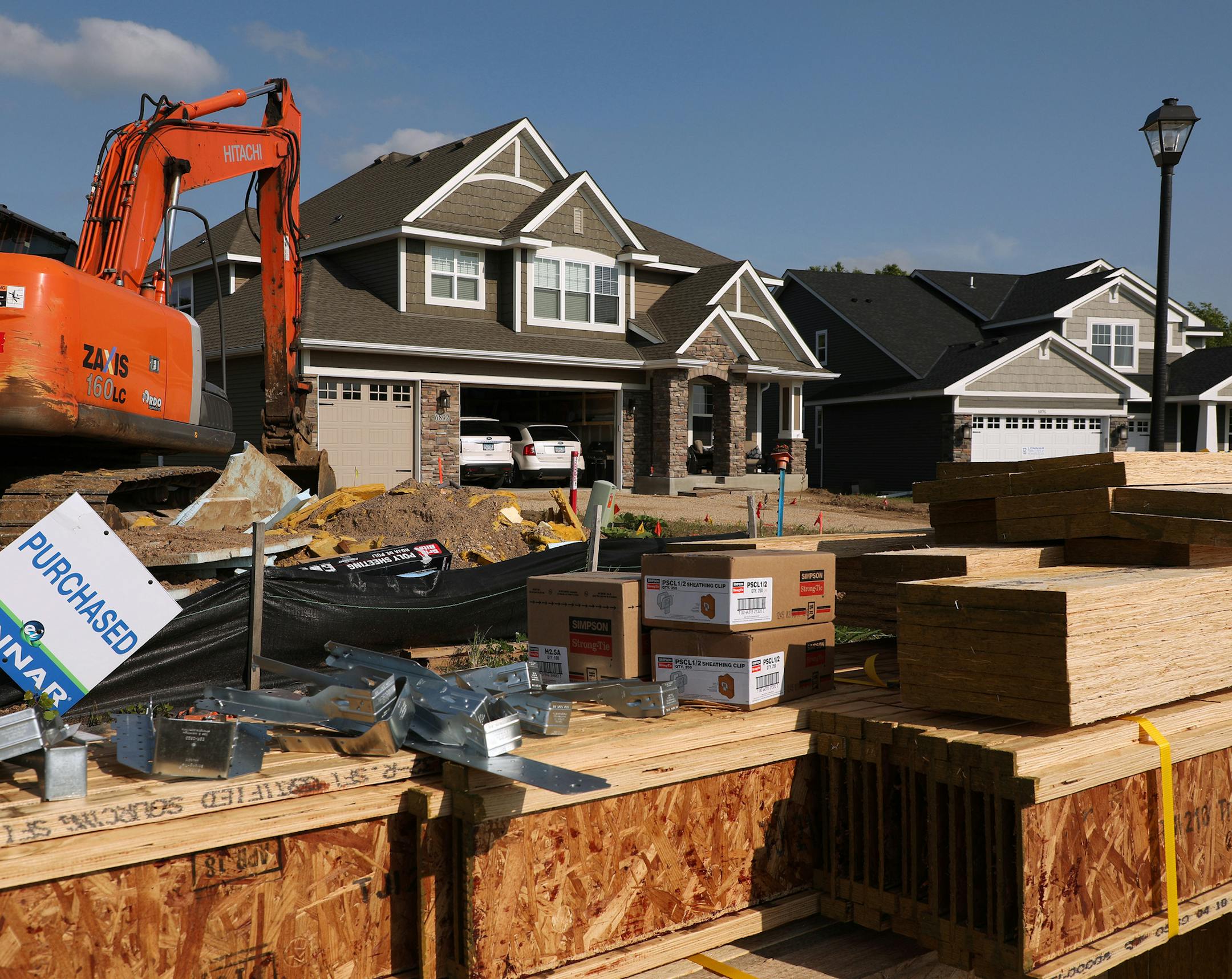 Building materials for a home currently under construction sat near several already inhabited homes in the Settler's Ridge development Wednesday. ] ANTHONY SOUFFLE ï anthony.souffle@startribune.com Construction continued on several homes at the Settler's Ridge development Wednesday, June 6, 2018 in Inver Grove Heights, Minn. With prices of existing houses increasing faster than new homes, homebuilders are hitting their stride. Builders pulled more permits last month to build single-family h