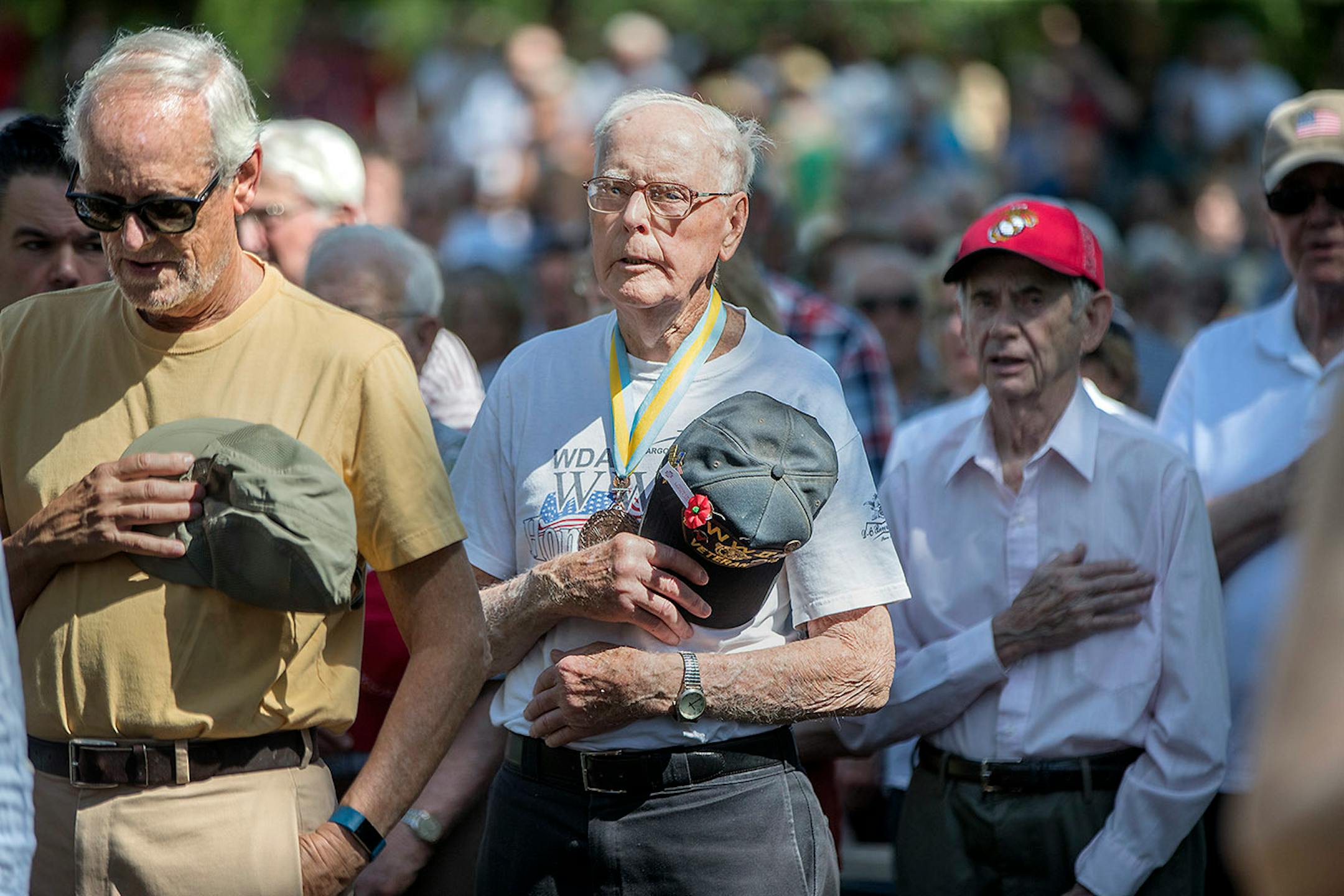 Dan Halverson, cq, center, an Army National Guard, 34th Red Bull Division and the 168th Rainbow Regimen member who fought in Italy in 1943, 1944, and 1945 , stood for the Posting of the Colors, at the annual Memorial Day Ceremony at Lakewood Cemetery, Monday, Ma 28, 2018 in Minneapolis, MN.