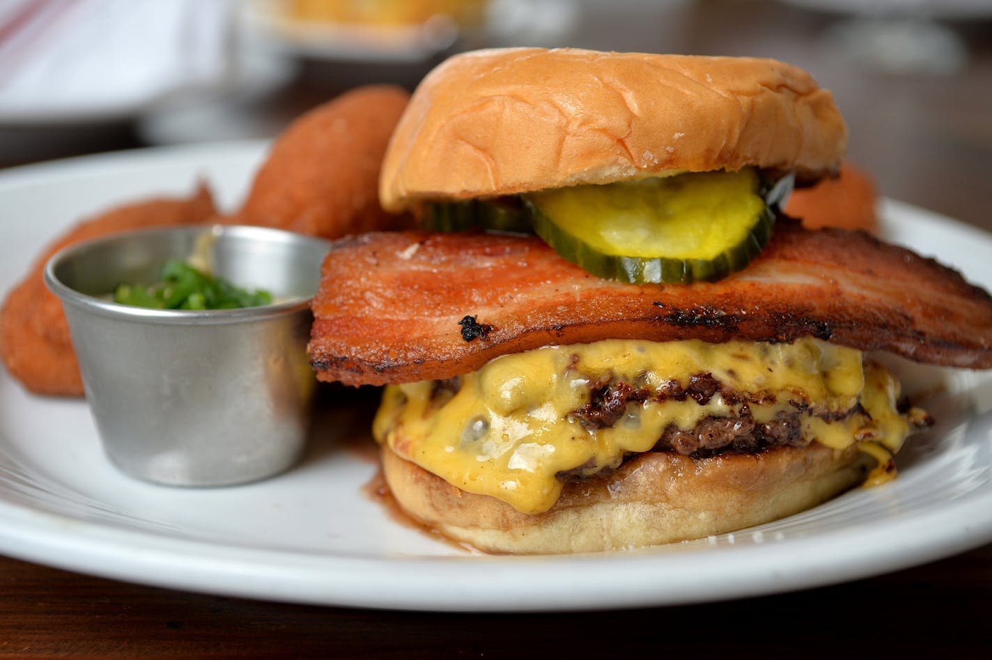 The double patty Revival Burger with American cheese. ] (SPECIAL TO THE STAR TRIBUNE/BRE McGEE) **Revival