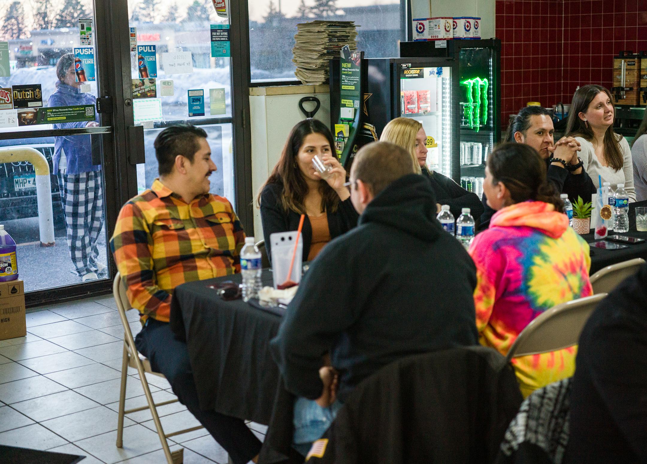 While the gas station is closed, guests enjoy the festive ambience inside.