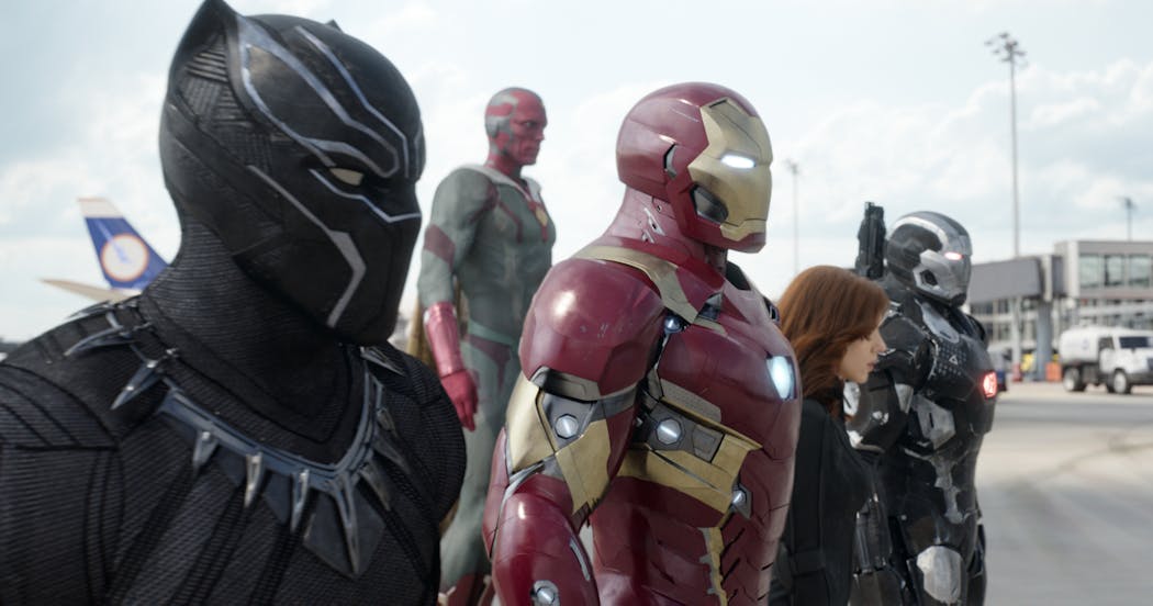 Chadwick Boseman as Panther, Paul Bettany as Vision, Robert Downey Jr. as Iron Man, Scarlett Johansson as Natasha Romanoff, and Don Cheadle as War Machine in a scene from “Marvel’s Captain America: Civil War.”