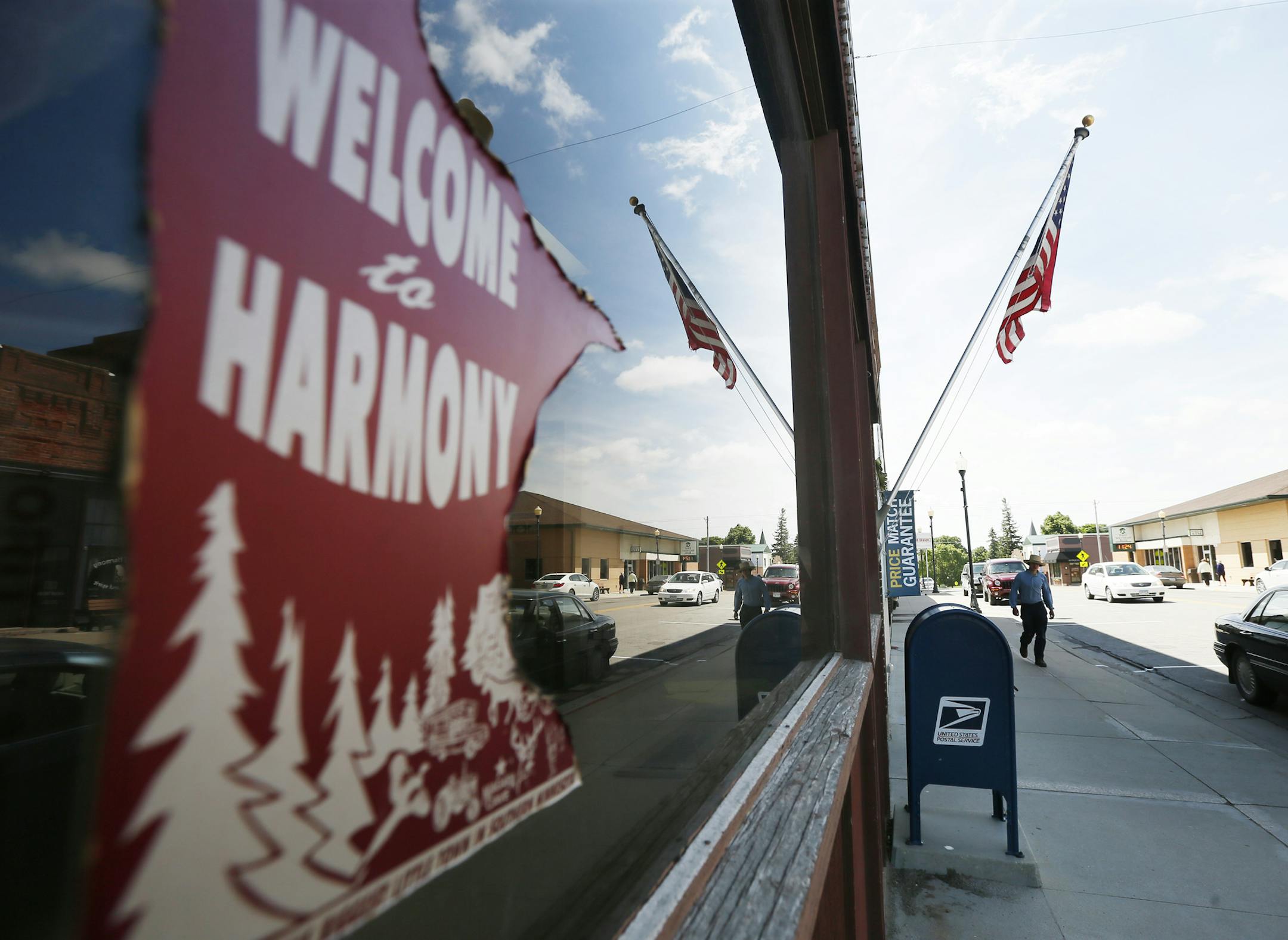 A Harmony resident walked to the post office on Main Thursday June 12, 2014 in Harmony ,MN.City officials in the town of Harmony have started a program to combat the rising age of its residents and the wants of its workforce. They will pay you $5,000 to $12,000 to build a home in their town. Harmony ,MN. ] Jerry Holt Jerry.holt@startribune.com