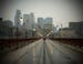 As severe weather approached downtown Minneapolis Thursday afternoon the Stone Arch bridge, normally full of pedestrians, was empty. ] MCKENNA EWEN mc