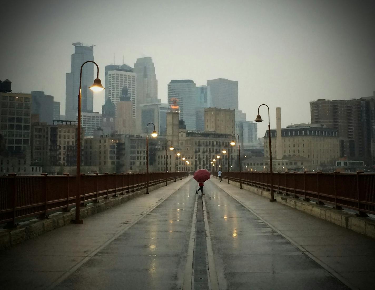 As severe weather approached downtown Minneapolis Thursday afternoon the Stone Arch bridge, normally full of pedestrians, was empty. ] MCKENNA EWEN mckenna.ewen@startribune.com - May 8, 2014, Minneapolis Star Tribune