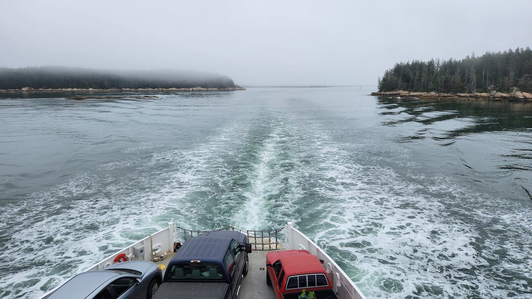 The Maine State Ferry Service’s carferry departed Vinalhaven through a misty channel in the Fox Islands. 