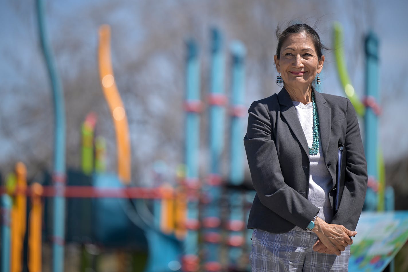 Interior Secretary Deb Haaland stands in front of a playground during a press conference Friday, May 6, 2022 at Midway Peace Park in St. Paul, Minn.. Haaland highlighted funding for cities to create new urban parks and trails and upgrade existing park infrastructure during a stop in St. Paul Friday, joined by state leaders.