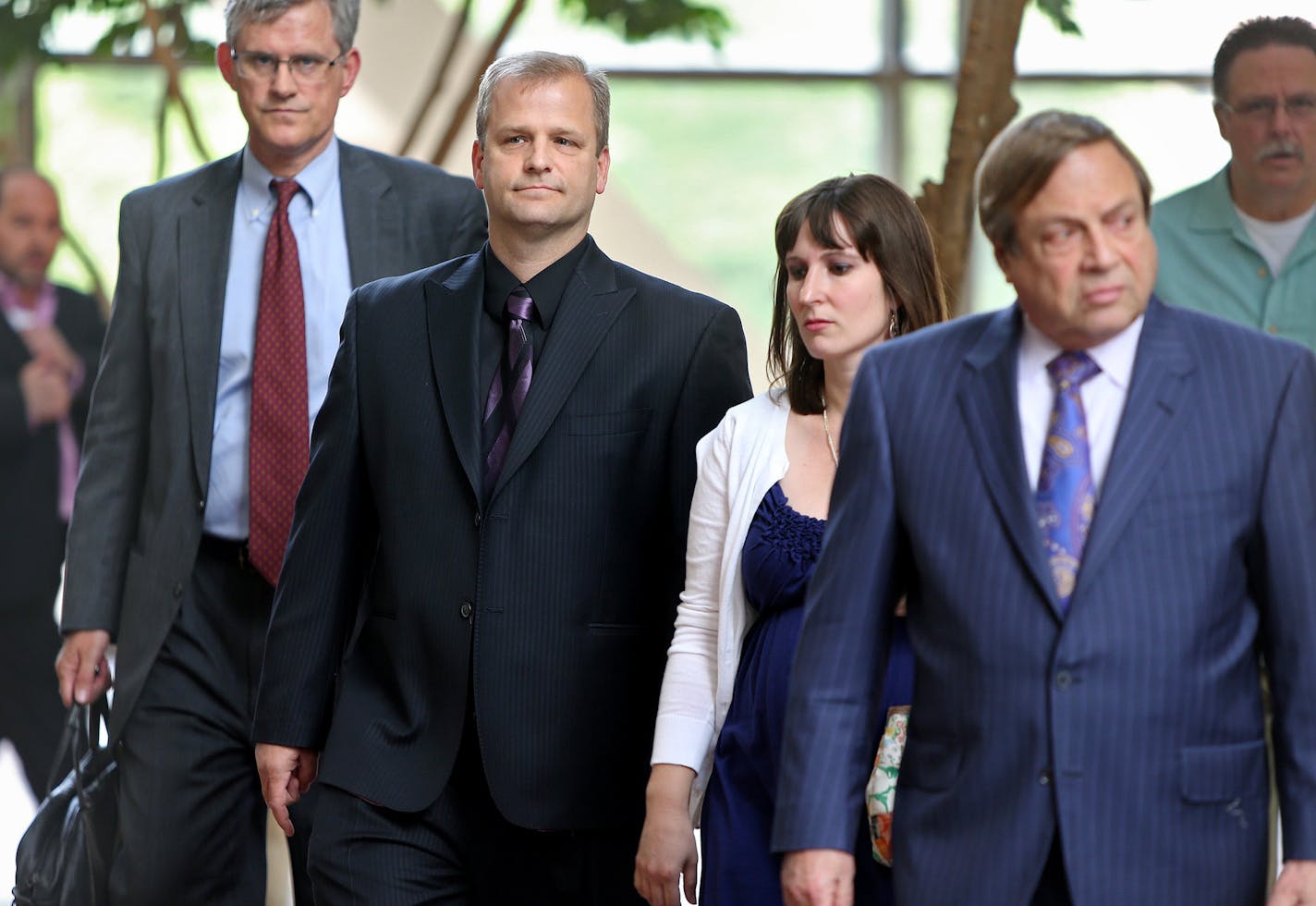 Jonathan Markle, second from left, made his way into the Hennepin County Government Center, Tuesday, June 25, 2013 in Minneapolis, MN. Markle the father who was legally drunk when his car went through the Lake Minnetonka ice last winter, killing his 8-month old daughter, returned to court in a motion hearing where his attorney Joe Friedberg, right, argued to suppress blood test results using a recent Supreme Court decision. (ELIZABETH FLORES/STAR TRIBUNE) ELIZABETH FLORES &#x201a;&#xc4;&#xa2; ef