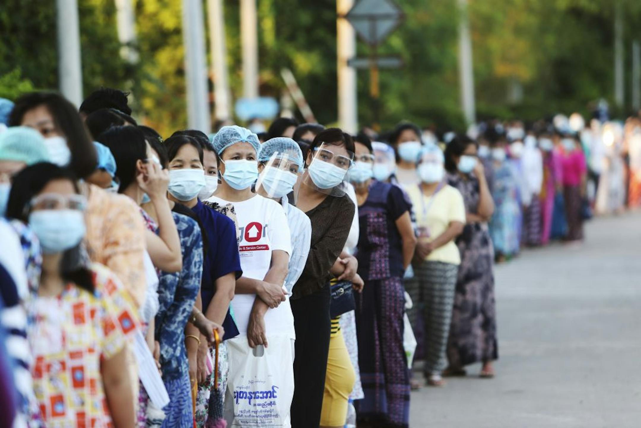 Voters line up to cast their ballots at a polling station Sunday, Nov. 8, 2020, in Naypyitaw, Myanmar. Voting was underway in Myanmar's elections on Sunday, with the party of Nobel Peace Prize laureate Aung San Suu Kyi heavily favored to retain power it had wrestled from the powerful military five years ago.