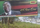 Traffic flows past a billboard with a portrait of Emmerson Mnangagwa the new Zimbabwean President in Harare, Zimbabwe, Monday, Nov.27, 2017. Zimbabwe'