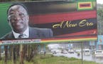 Traffic flows past a billboard with a portrait of Emmerson Mnangagwa the new Zimbabwean President in Harare, Zimbabwe, Monday, Nov.27, 2017. Zimbabwe'