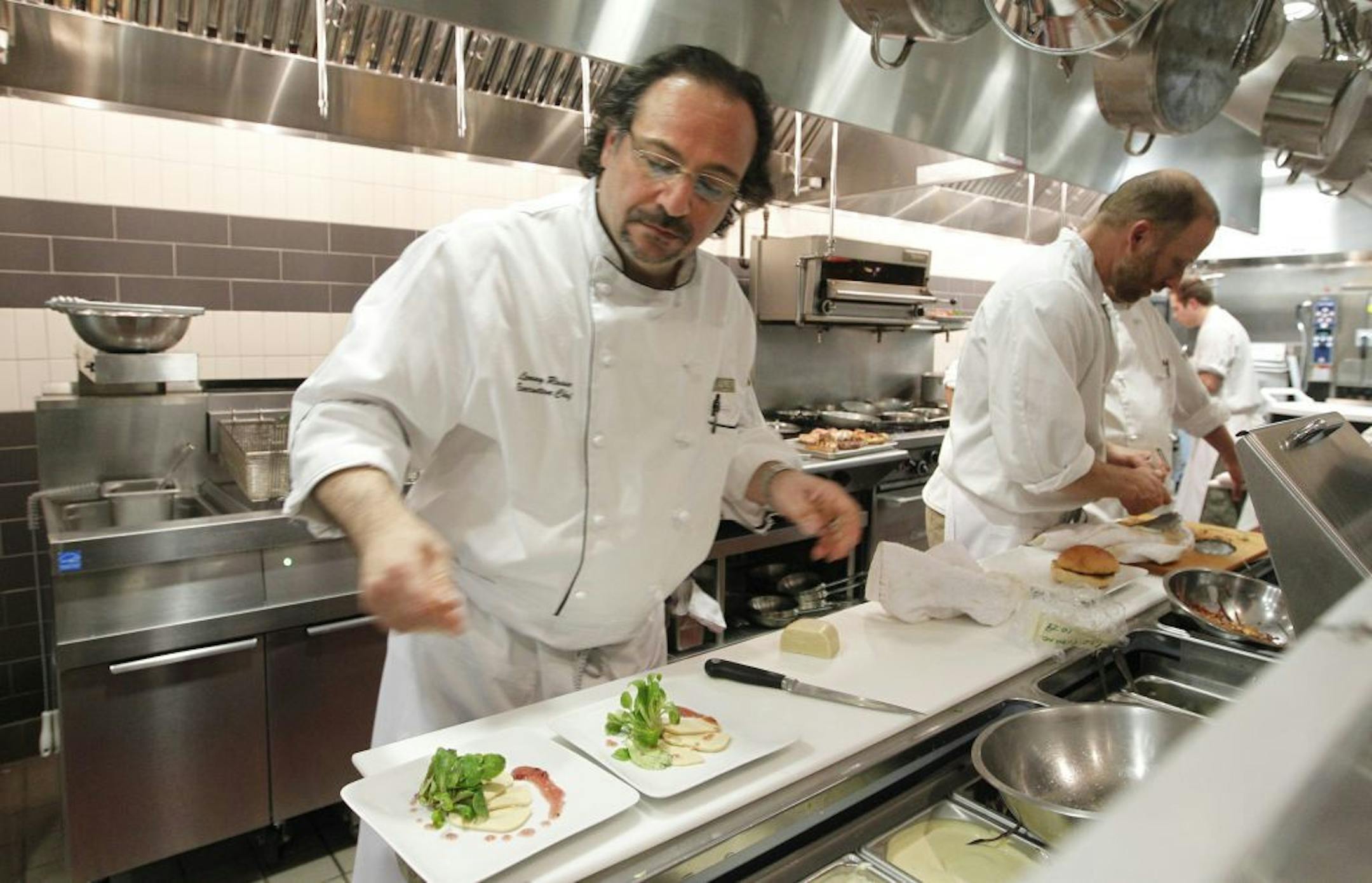 Chef Lenny Russo in his new kitchen Prep a salad plate for his chefs table guests.bestmn2012 bestmn2012