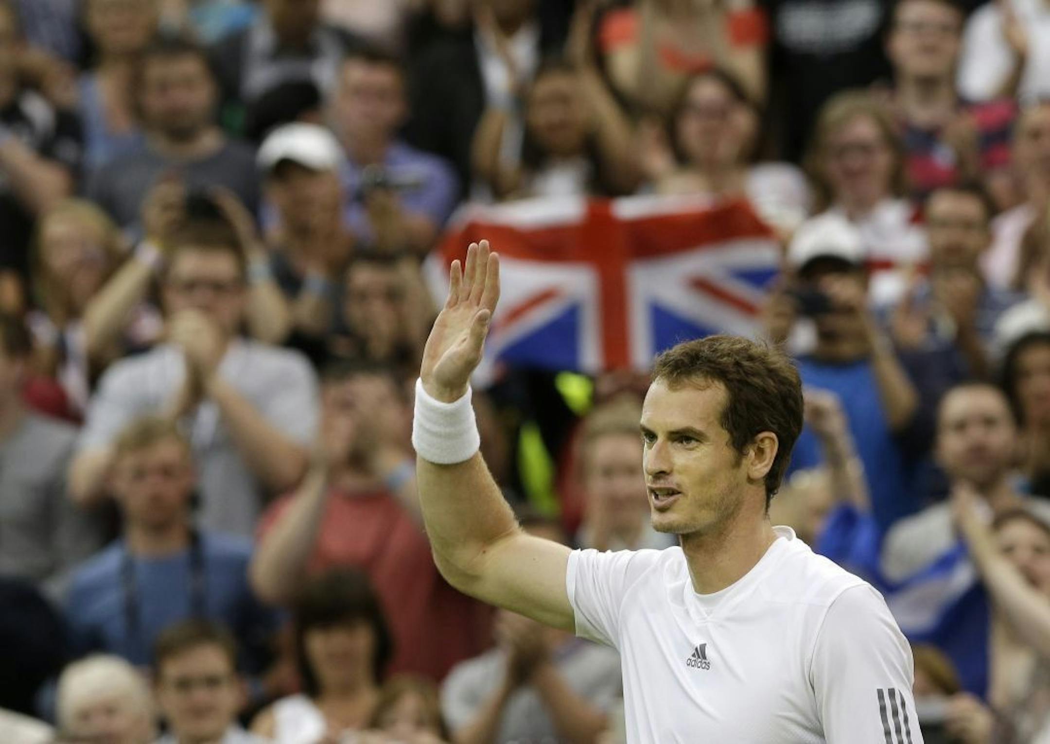 Andy Murray of Britain reacts after defeating Tommy Robredo of Spain during their Men's singles match at the All England Lawn Tennis Championships in Wimbledon, London, Friday, June 28, 2013.