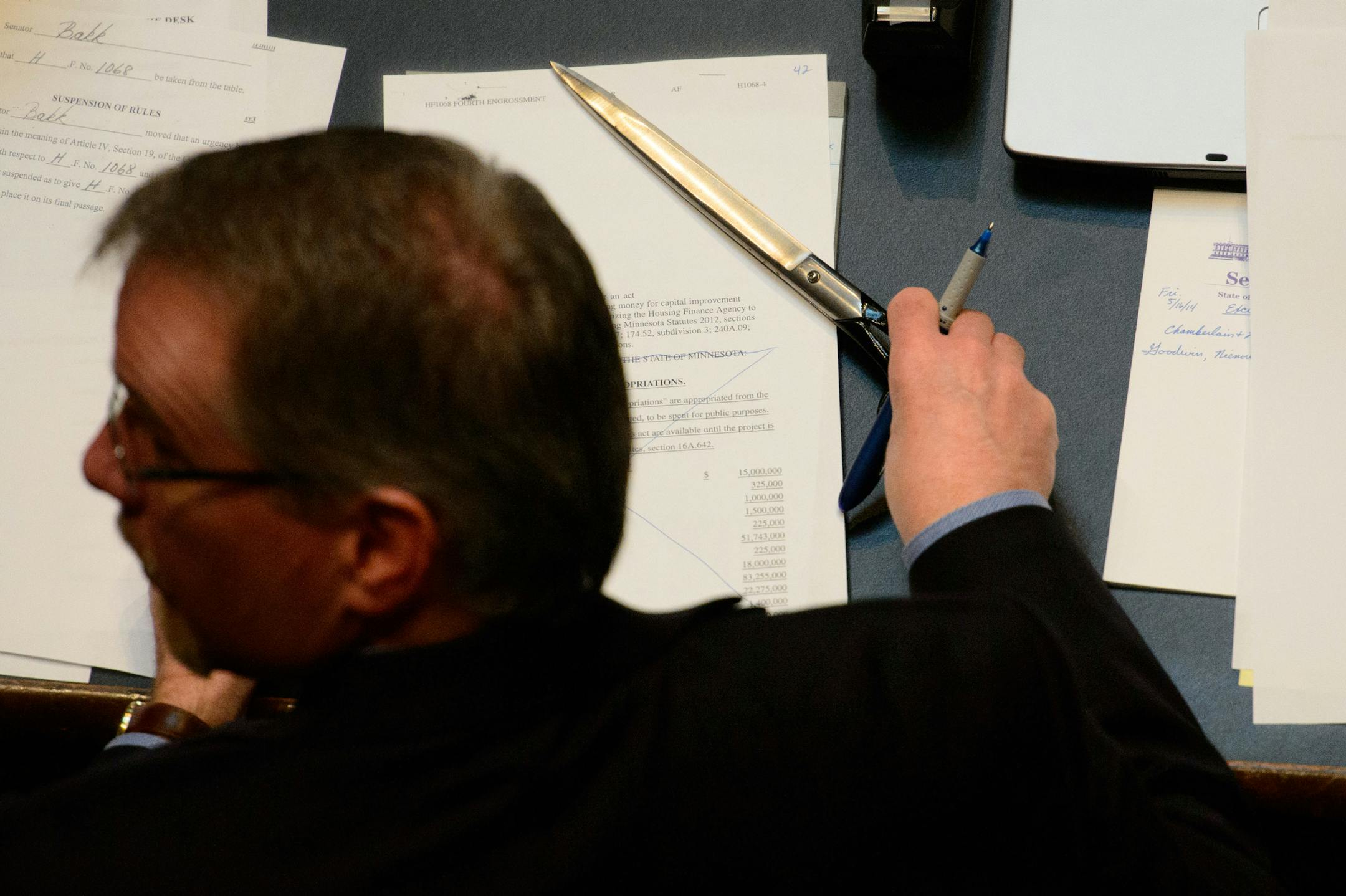 Mike Linn Second Assistant Secretary of the Senate wields a huge scissor as he handles the flow of bills and amendments. ] Friday, May 16, 2014 GLEN STUBBE * gstubbe@startribune.com
