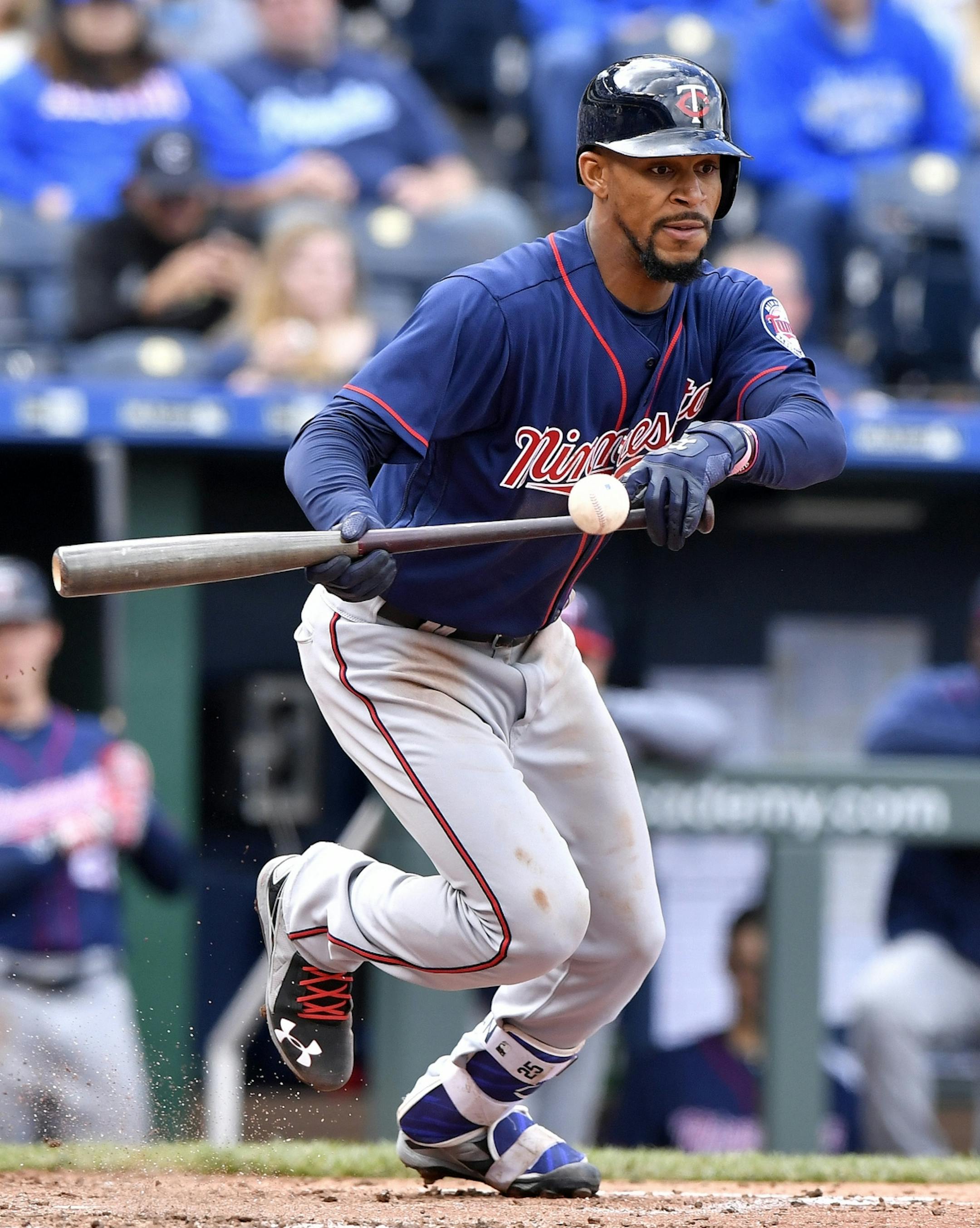 Minnesota Twins' Byron Buxton lays down a bunt single in the fourth inning against the Kansas City Royals on Sunday, April 30, 2017 at Kauffman Stadium in Kansas City, Mo.