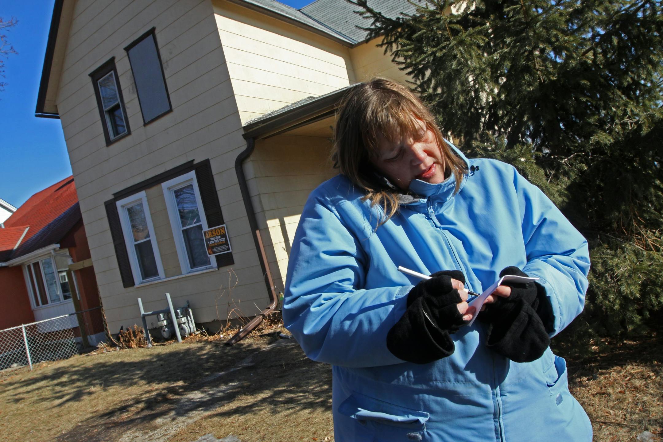Laura Haslach, who lived on the first floor of the duplex at 1070 Marion St. in St. Paul, talked to her insurance agent after a fire severly damaged the rear and upper levels of the building.