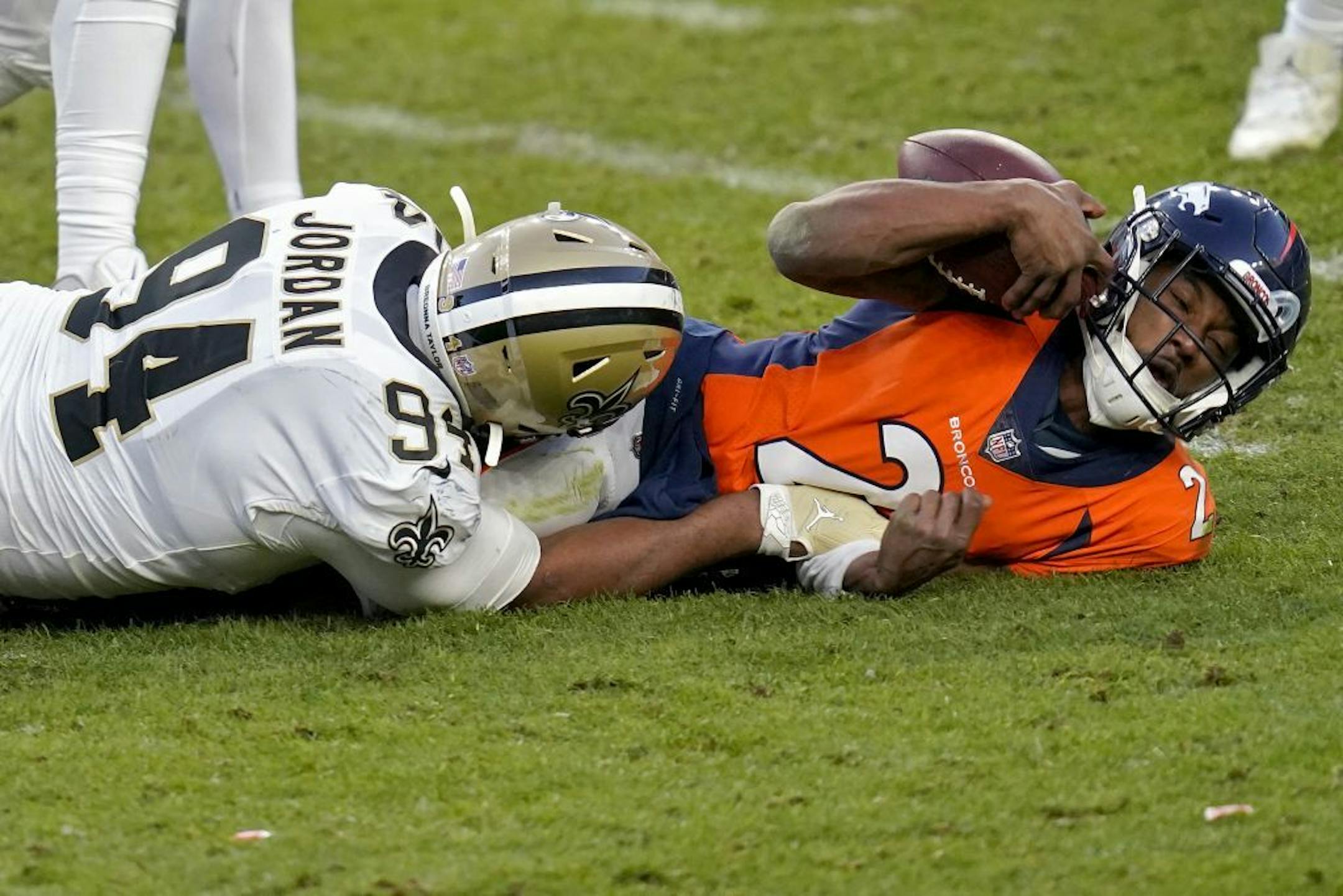 New Orleans Saints defensive end Cameron Jordan (94) sacks Denver Broncos quarterback Kendall Hinton (2) during the second half of an NFL football game, Sunday, Nov. 29, 2020, in Denver.