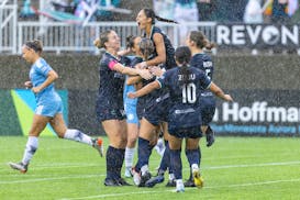 Minnesota Aurora players celebrate one of two goals scored by Mariah Nguyen, center, on Saturday vs. Chicago City SC.