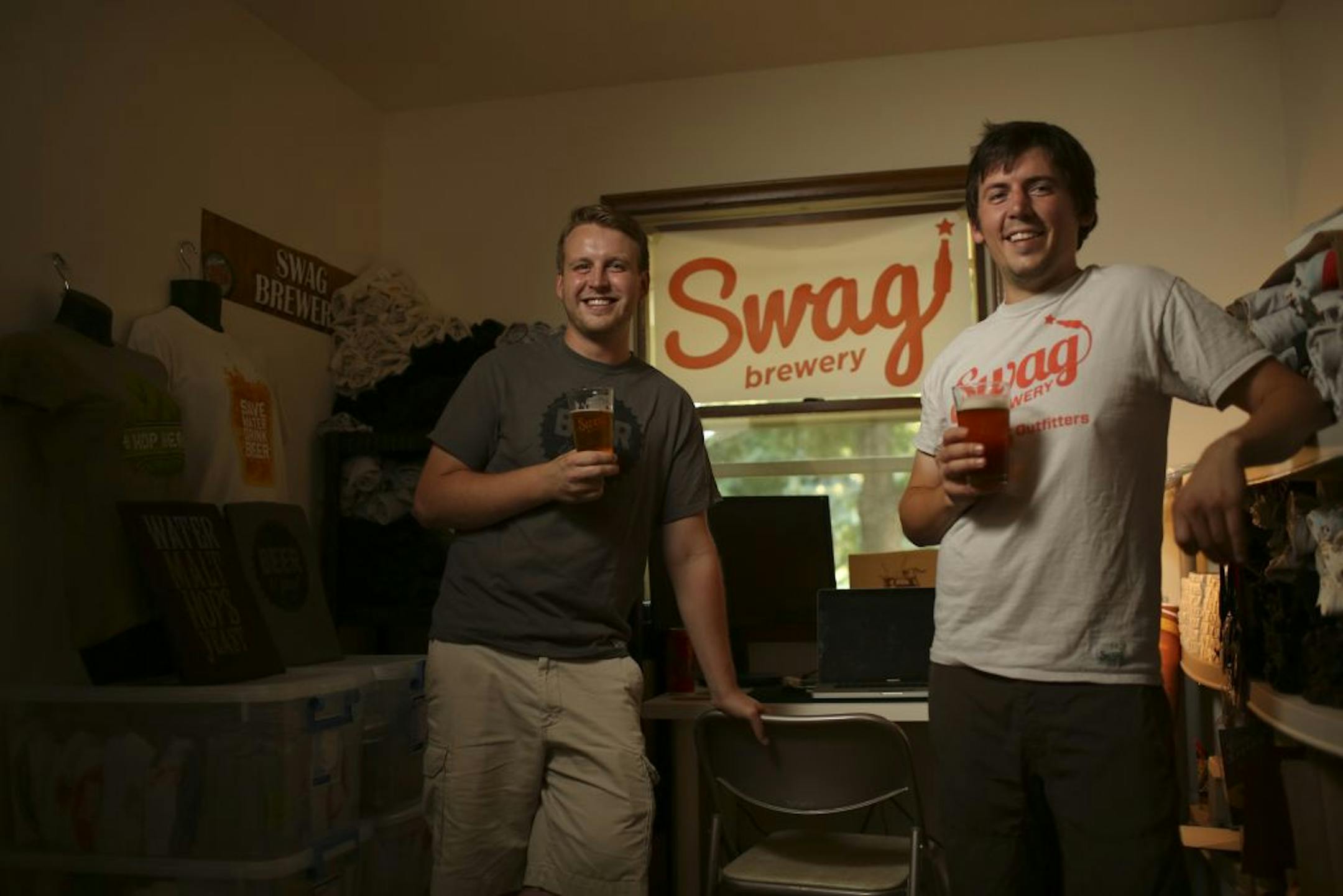 Colin McSteen, left, and Max Arndt in the Swag Brewery world headquarters — a spare room in Arndt's White Bear Lake house. Swag isn't a brewery, though; it sells beer-related paraphernalia.