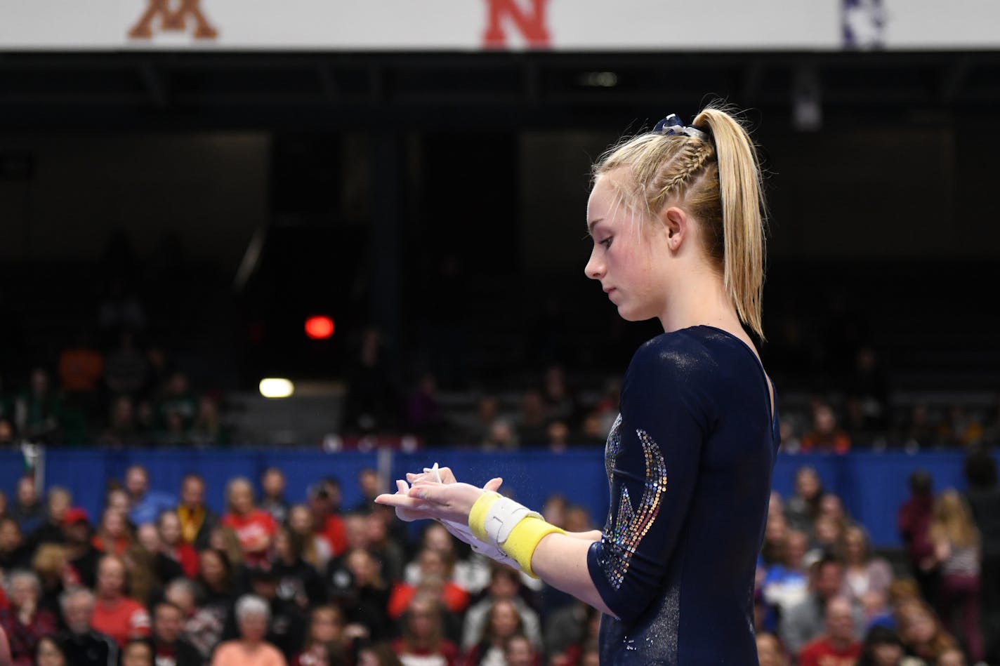 Chaney Neu of Champlin park waited to begin her routine on the uneven bars at the state meet last February. COURTNEY DEUTZ • courtney.deutz@startribune.com