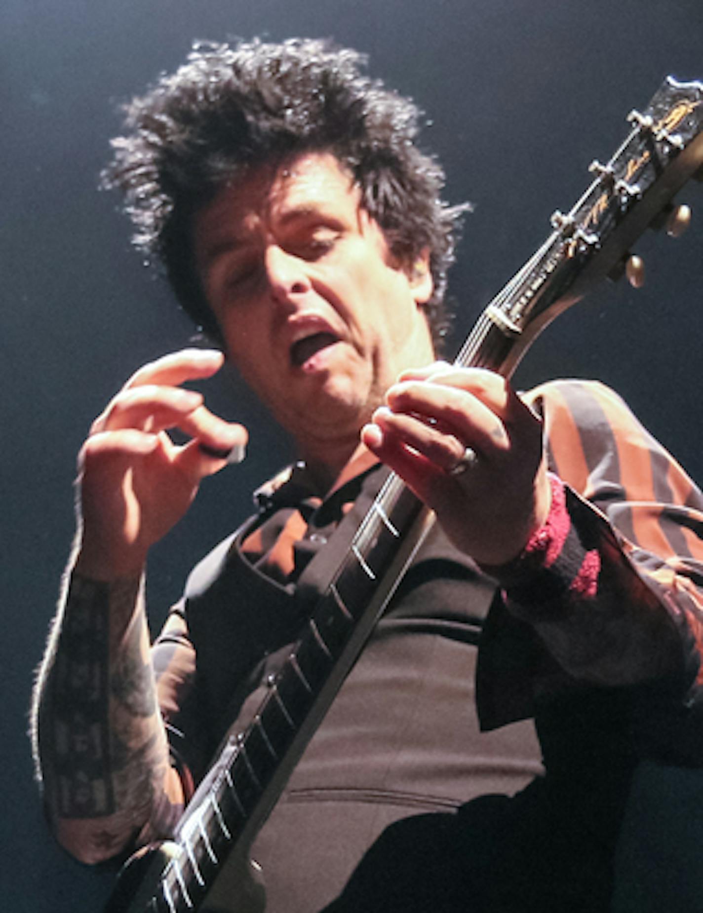 Green Day vocalist Billie Joe Armstrong jams on his guitar at the Xcel Energy Center Saturday night. Photo By: Matt Weber