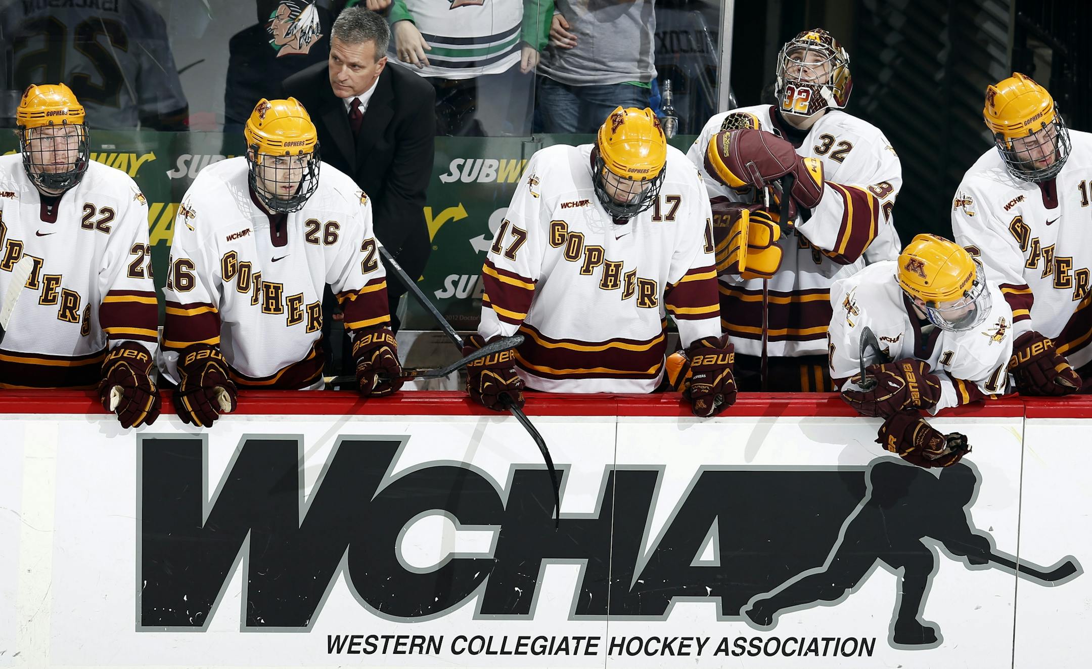 Head coach Don Lucia and Gophers players