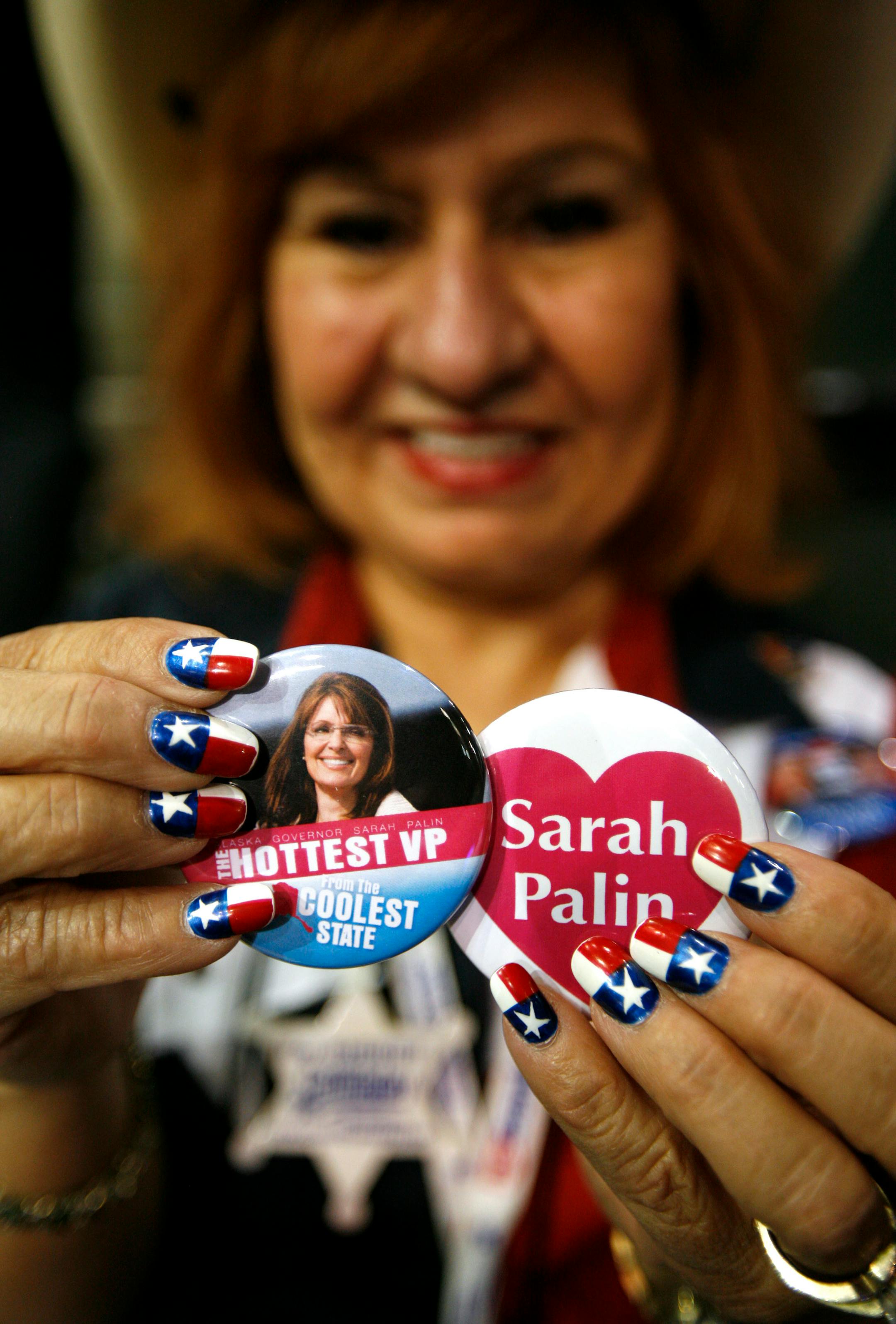 Texas delegate Margaret Lopez holds buttons supporting Republican vice presidential candidate Sarah Palin at the Xcel Energy Center in St. Paul, Minnesota, Thursday, September 4, 2008.