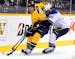 Nashville Predators defenseman Ryan Suter (20) is controls the puck under pressure from St. Louis Blues center David Backes (42) in the first period o