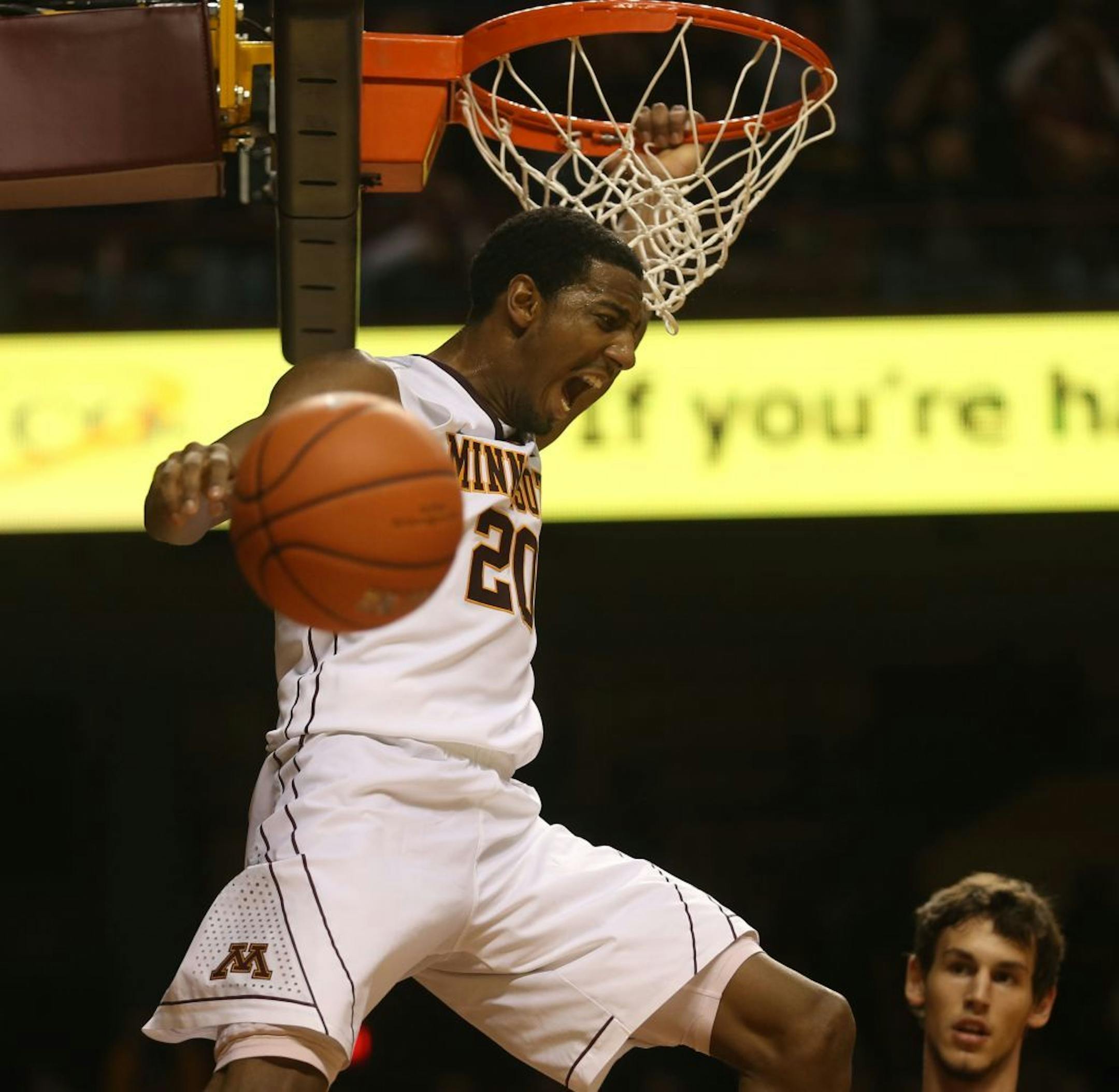 Gophers Austin Hollins dunked he ball during the second half at Williams Arena in Minneapolis, Tuesday, December 3, 2013. Gophers won 71-61 over Florida State.