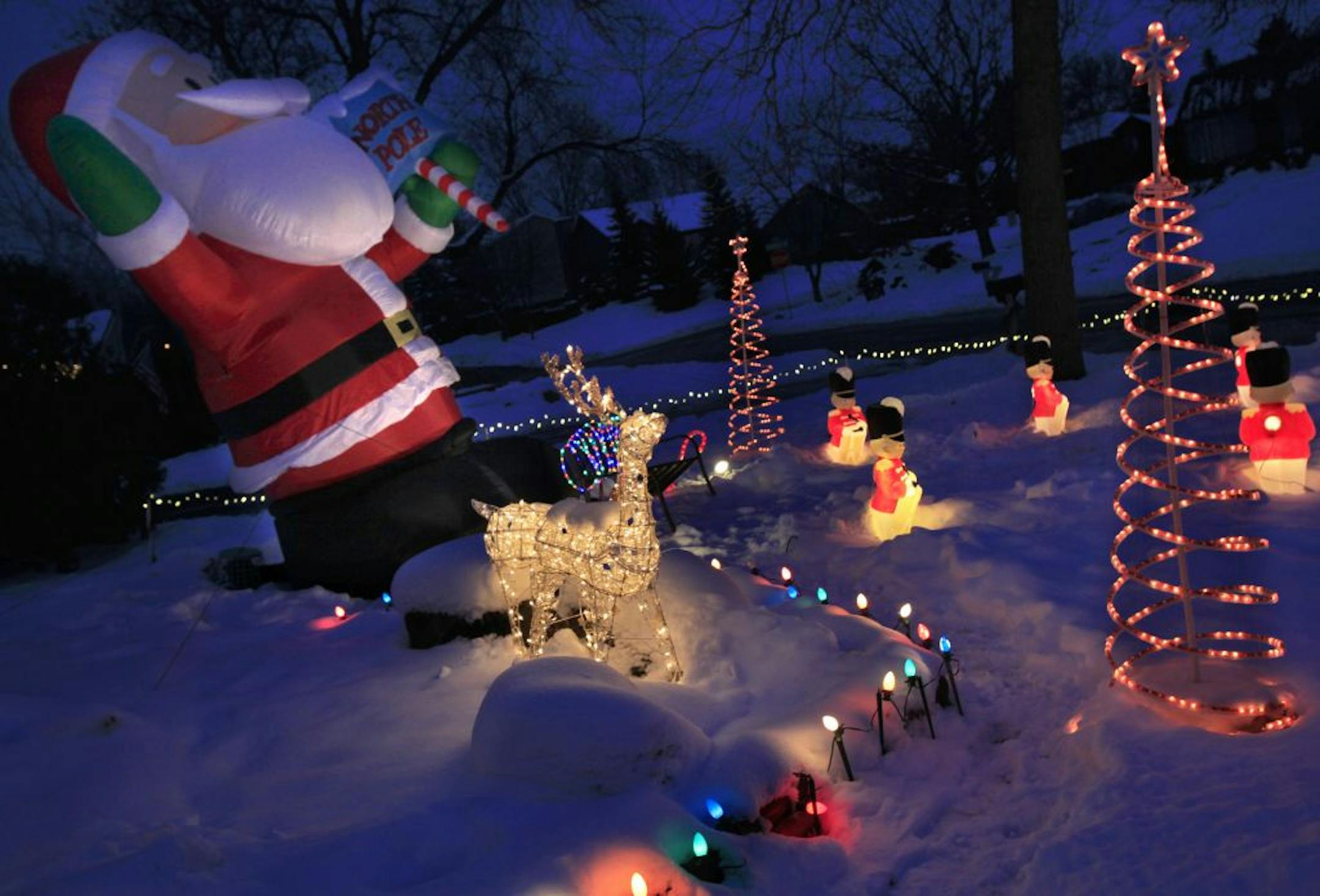 Michael and Shirley Esch deck their house out with thousands of lights every year and even dress up like Santa and Mrs. Claus to collect food donations for the hungry in Burnsville, MN on December 12, 2012.