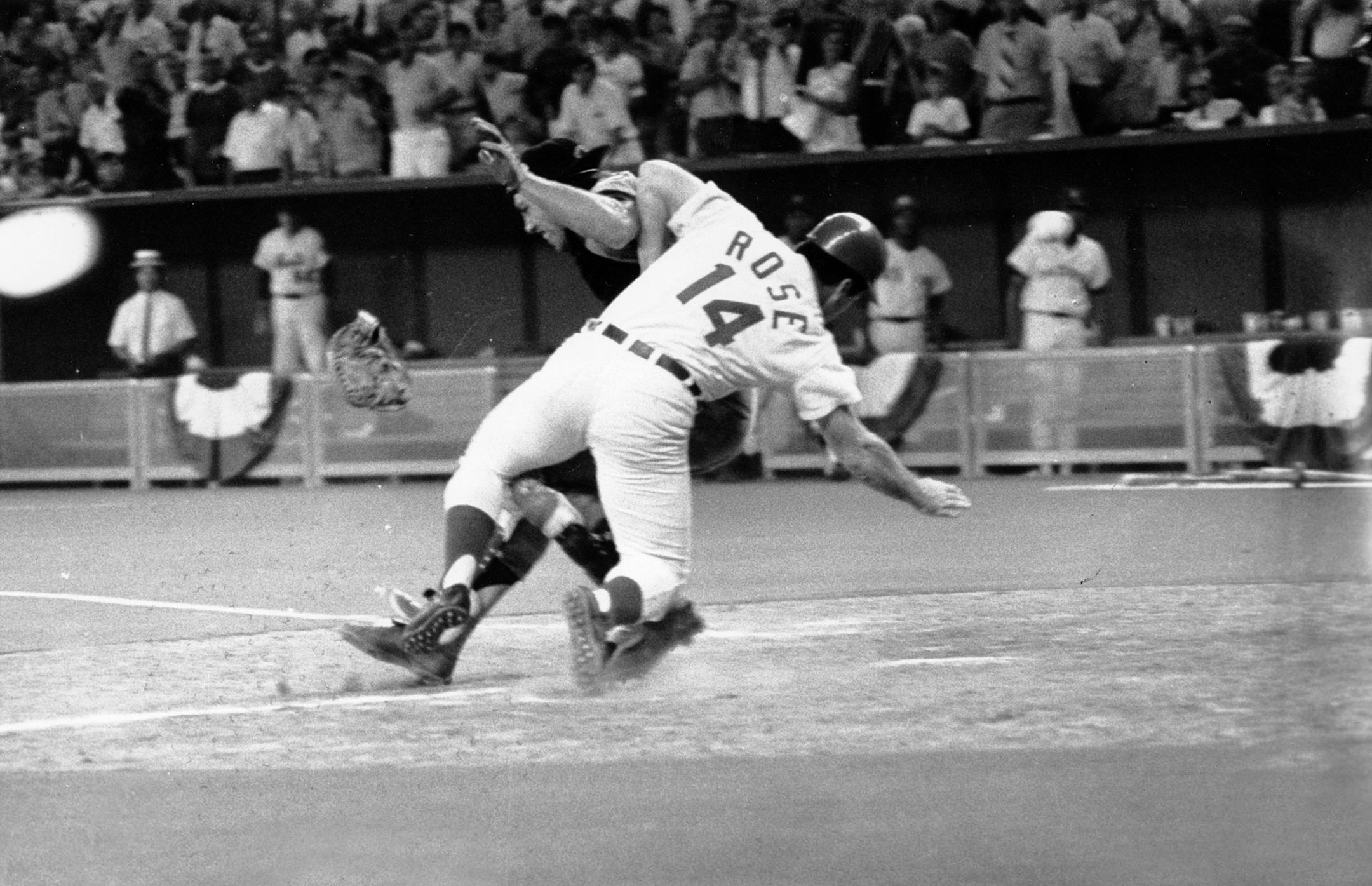 National League's Pete Rose collides into American League catcher Ray Fosse as he scores the winning run during the All-Star Game in Cincinnati, Ohio on July 14, 1970. Fosse was taken to a local hopital for observation. (AP Photo) ORG XMIT: APHS175