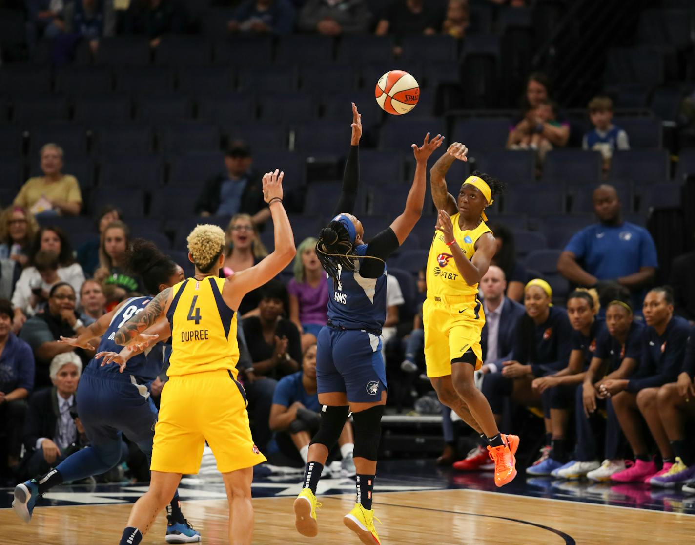 Lynx guard Odyssey Sims tried to intercept a pass from Fever guard Erica Wheeler to forward Candice Dupree in the first quarter at Target Center on Sunday.