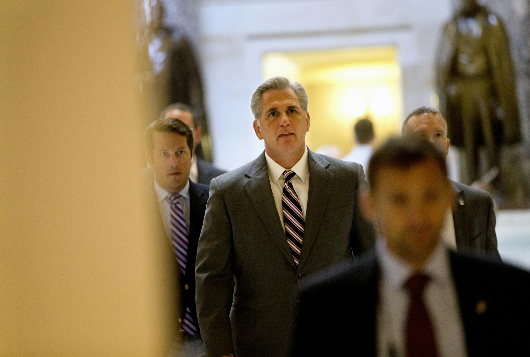 House Majority Leader Kevin McCarthy of Calif., center, walks to the floor of the House on Capitol Hill in Washington, Friday, Sept. 18, 2015, to a vote to block Planned Parenthood's federal funds for a year. (AP Photo/Jacquelyn Martin)