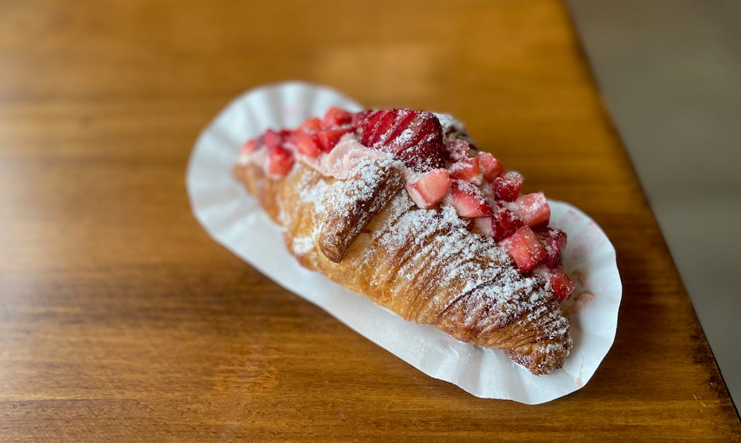 Everything wonderful about strawberries and cream packed inside a showboat of a croissant.