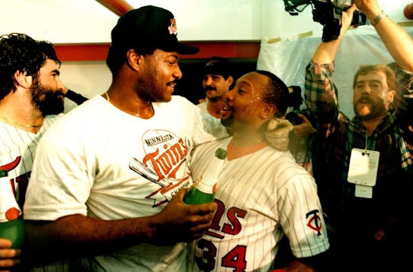 Don Baylor and Kirby Puckett celebrate the Twins winning the 1987 World Series.