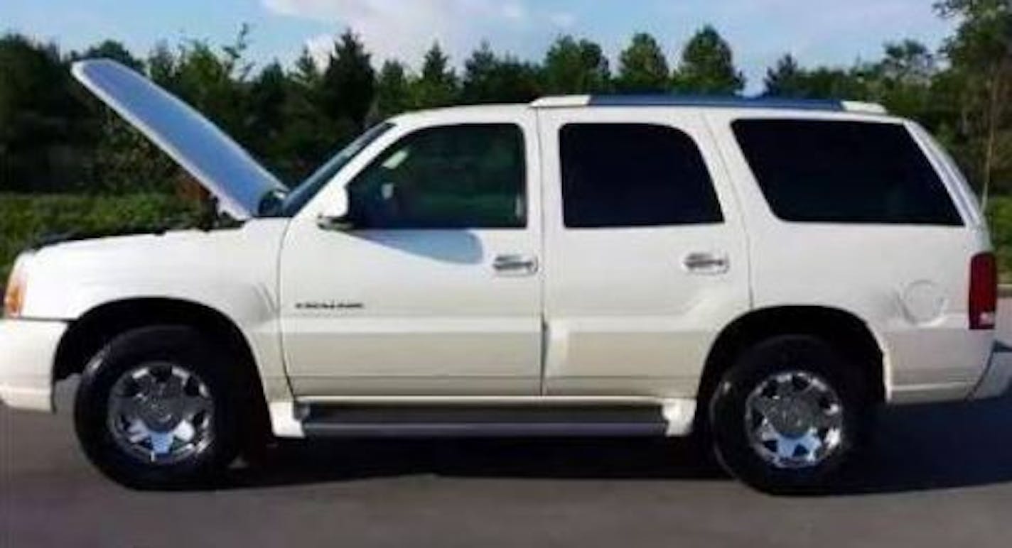 Authorities are looking for a white Cadillac Escalade. This photo represents the make and model but is not the actual vehicle connected with this case.