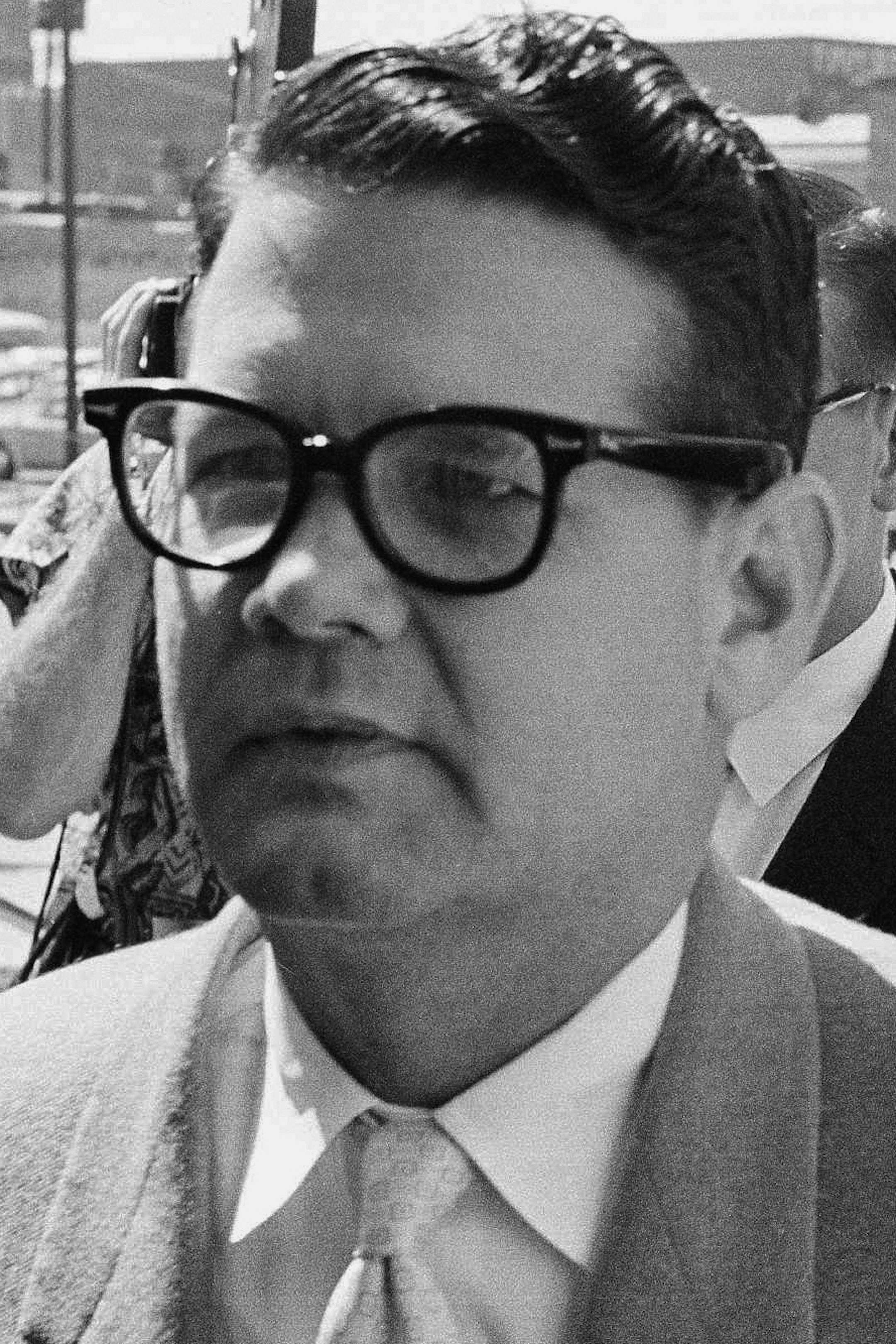 FILE - In this May 23,1962 file photo, Billie Sol Estes, left, and his attorney John Cofer of Austin, Tex. are shown as they arrived at the federal court house in El Paso, Texas. Estes, the flamboyant Texas huckster and con man, has died at age 88. Hood County Sheriff Roger Deed says Estes was found dead in his home in Hood County, Texas, by a caregiver early Tuesday, May 14, 2013. (AP Photo/Ferd Kaufman, File)