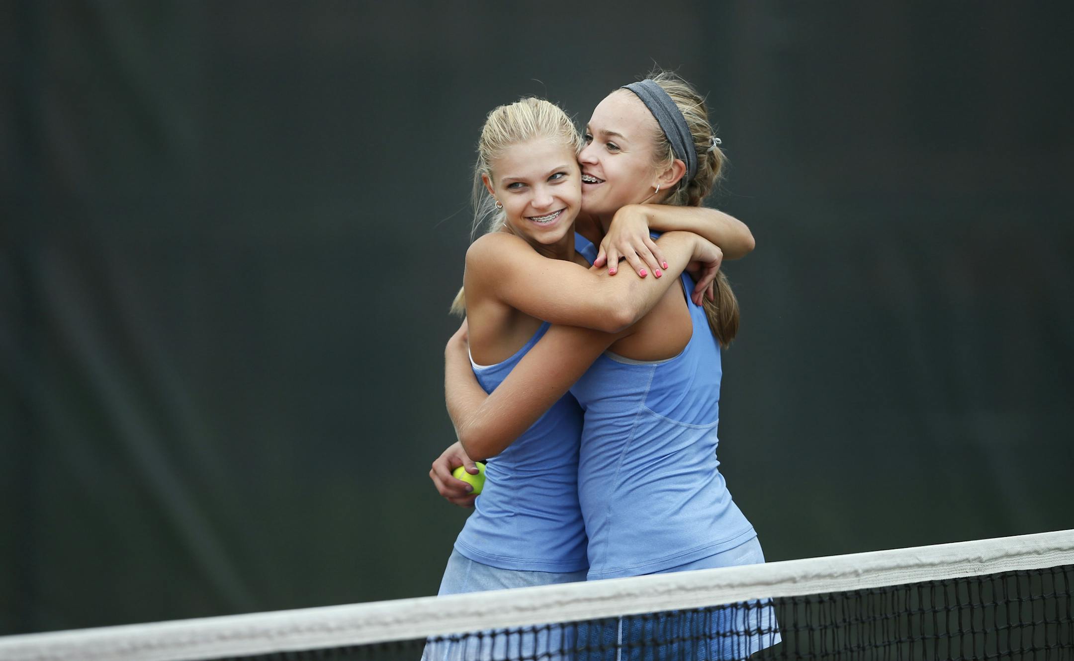 Sisters Taylor and ,Jordan Kopfer of the Eastview girls tennis team hugged each other after winning the matches at Lakeville South High Tuesday September 10, 2013 ] JERRY HOLT ‚Ä¢ jerry.holt@startribune.com